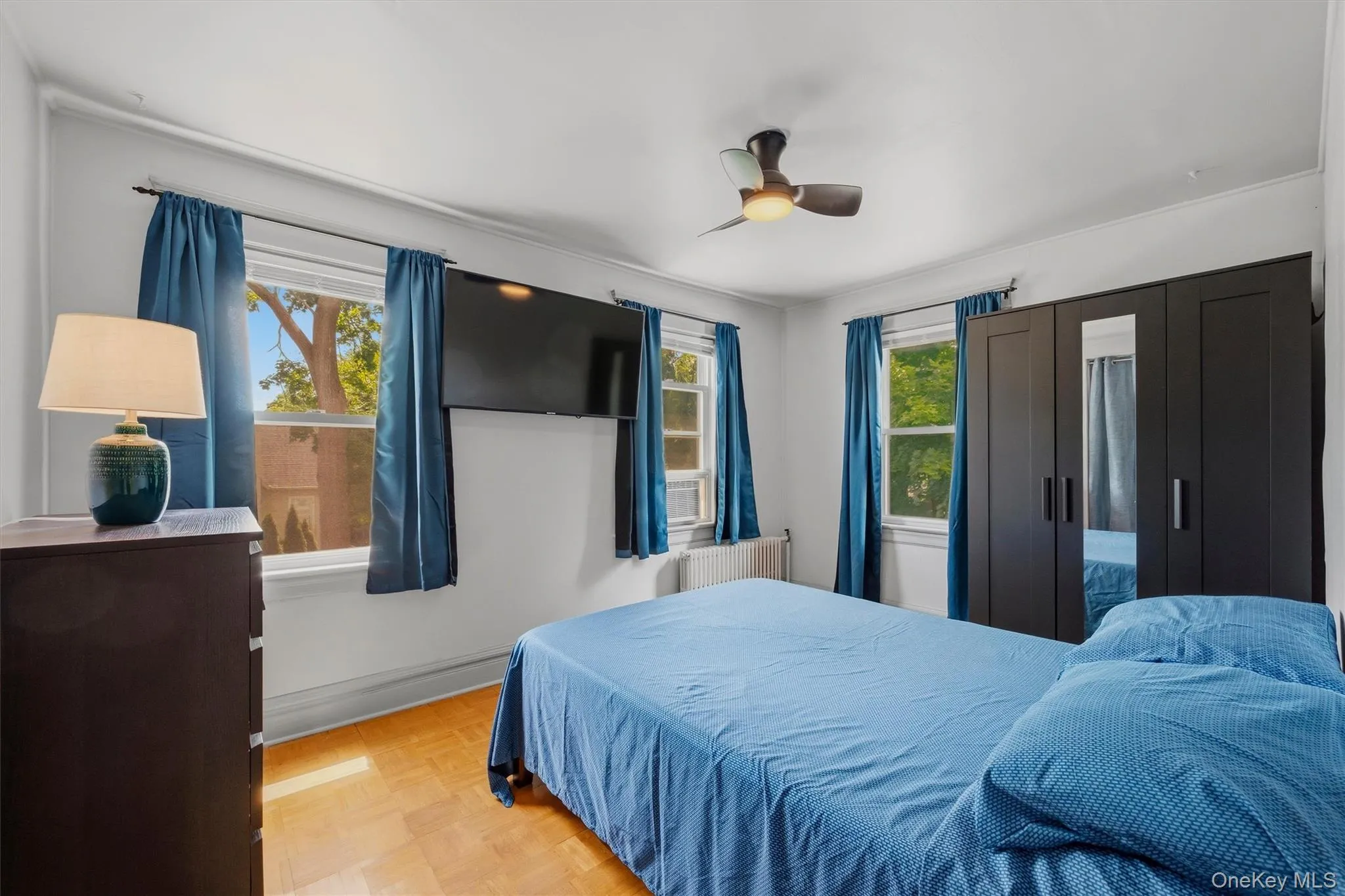 White walls with parquet wood-finish flooring White walls with parquet wood-finish flooring