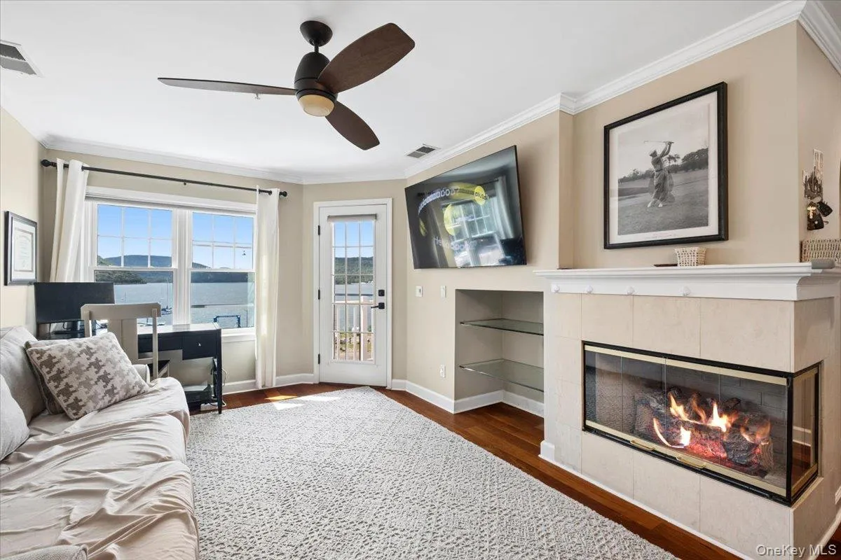 Hardwood-style flooring , crown molding and gas fireplace Hardwood-style flooring , crown molding and gas fireplace