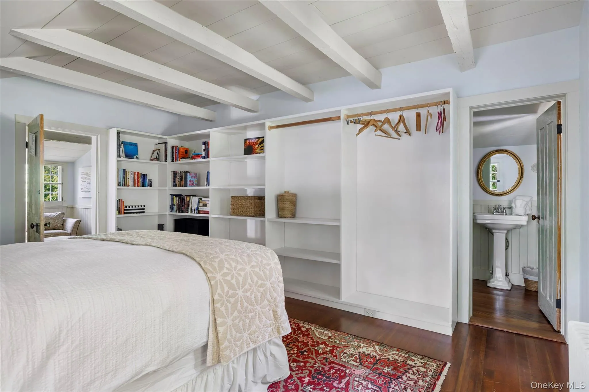 Light-filled guest bedroom with custom built-ins and en suite half bath Light-filled guest bedroom with custom built-ins and en suite half bath