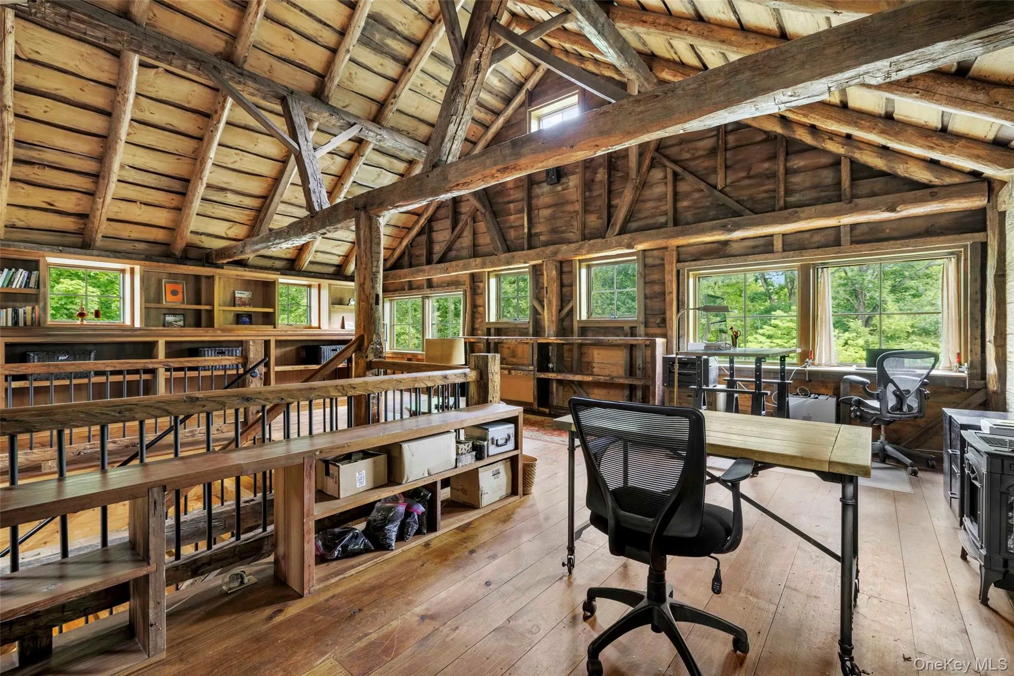 Upper gallery overlooking the great hall, ideal for a library, office, studio, or creative workspace Upper gallery overlooking the great hall, ideal for a library, office, studio, or creative workspace