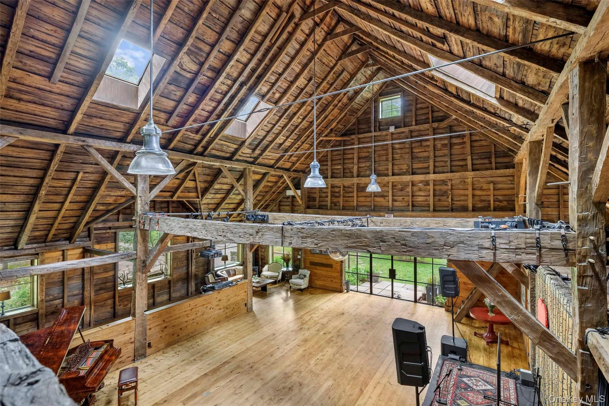Vaulted ceilings, original timber framing and dramatic scale showcase the barn’s remarkable architectural character Vaulted ceilings, original timber framing and dramatic scale showcase the barn’s remarkable architectural character