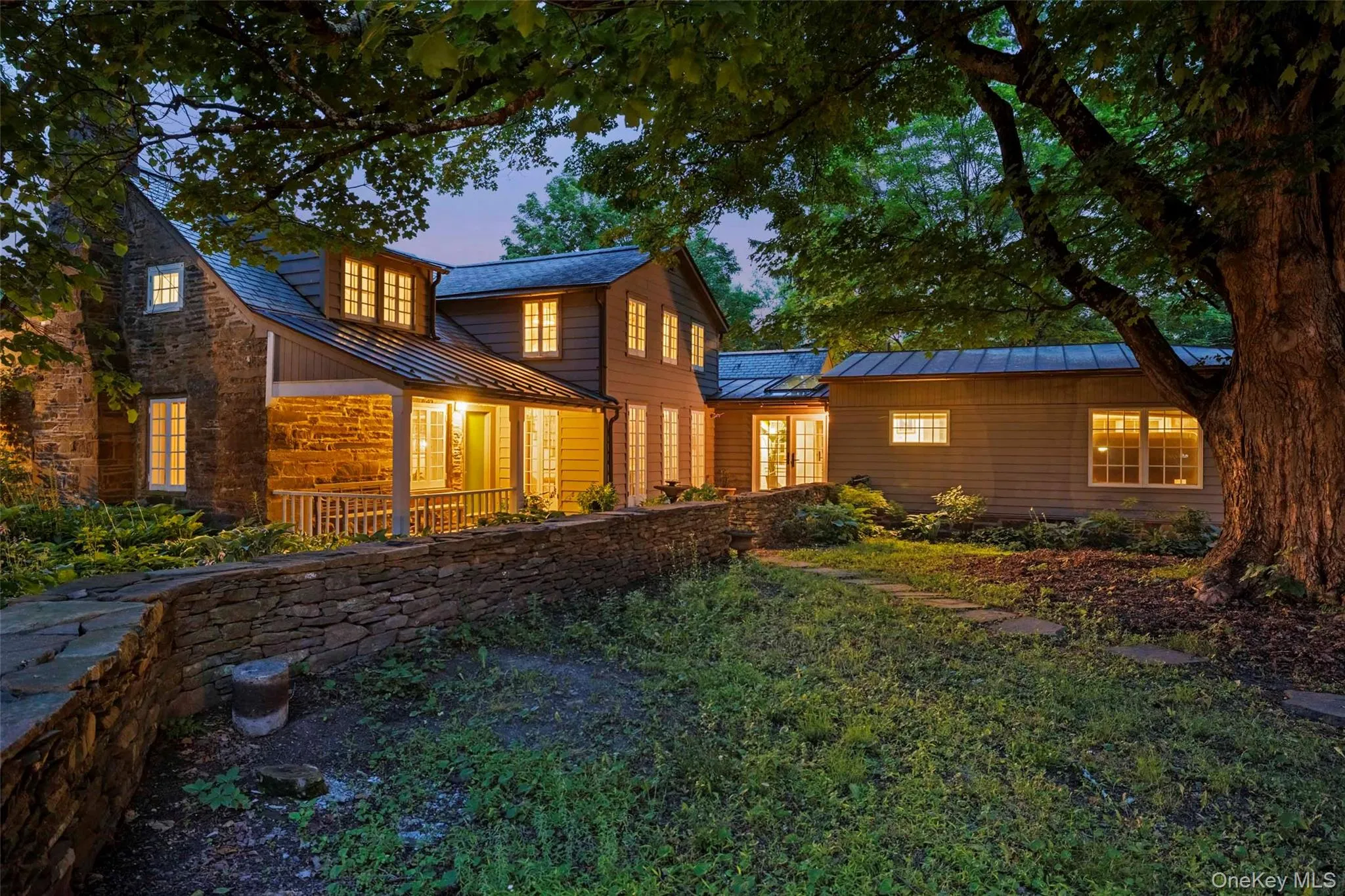 As evening falls, warm light spills from every wing, creating an inviting sense of comfort and timeless country elegance As evening falls, warm light spills from every wing, creating an inviting sense of comfort and timeless country elegance