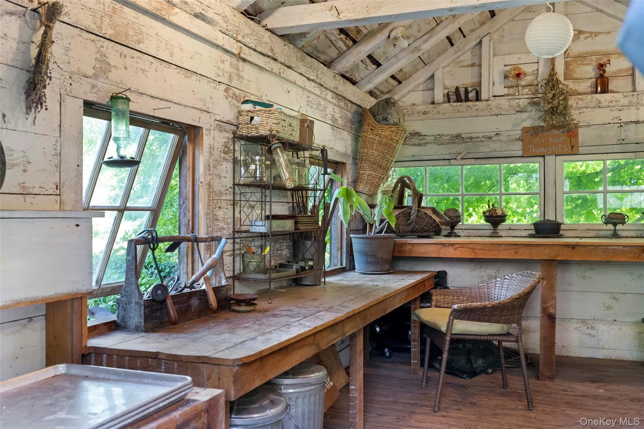 Charming potting shed with generous potting benches, abundant workspace, and period character Charming potting shed with generous potting benches, abundant workspace, and period character
