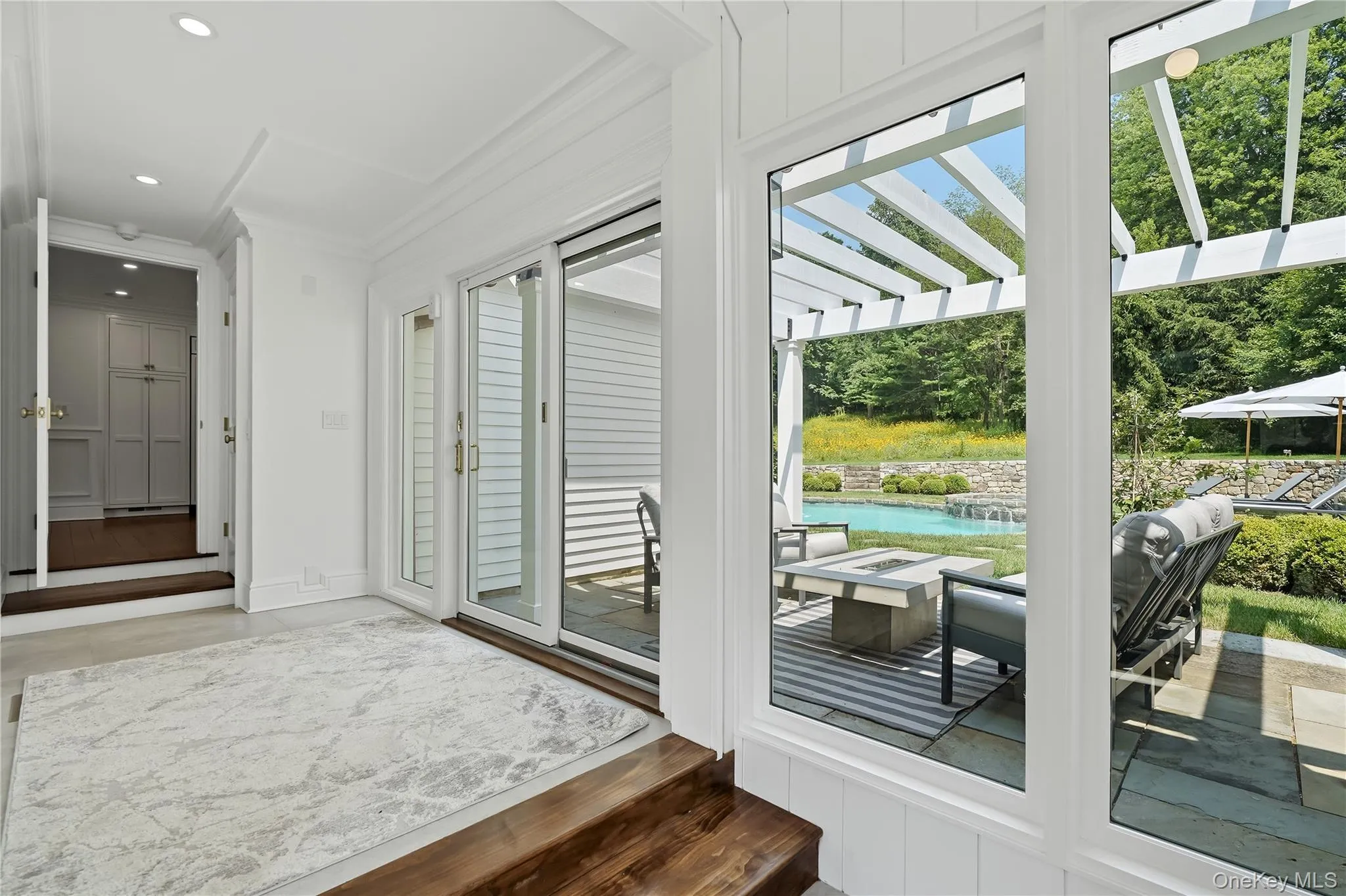 Mudroom with glass sliders to the pool area Mudroom with glass sliders to the pool area