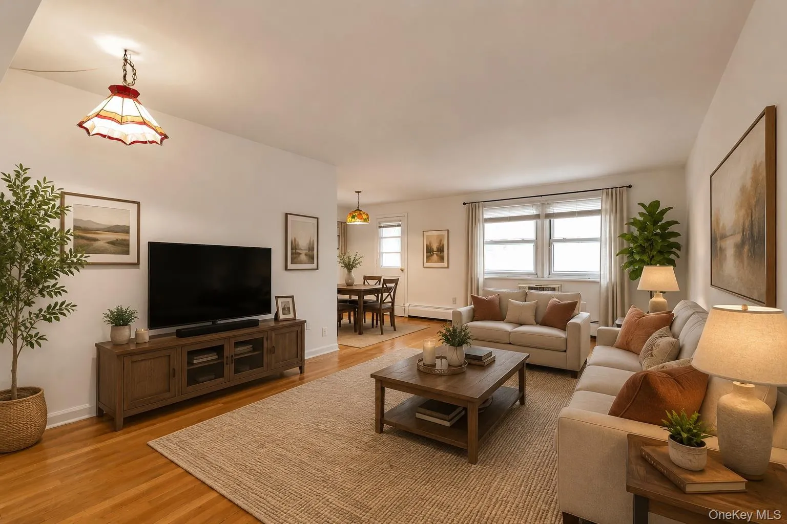 Virtually Staged Living Room / Dining Area with Hardwood Floors Virtually Staged Living Room / Dining Area with Hardwood Floors