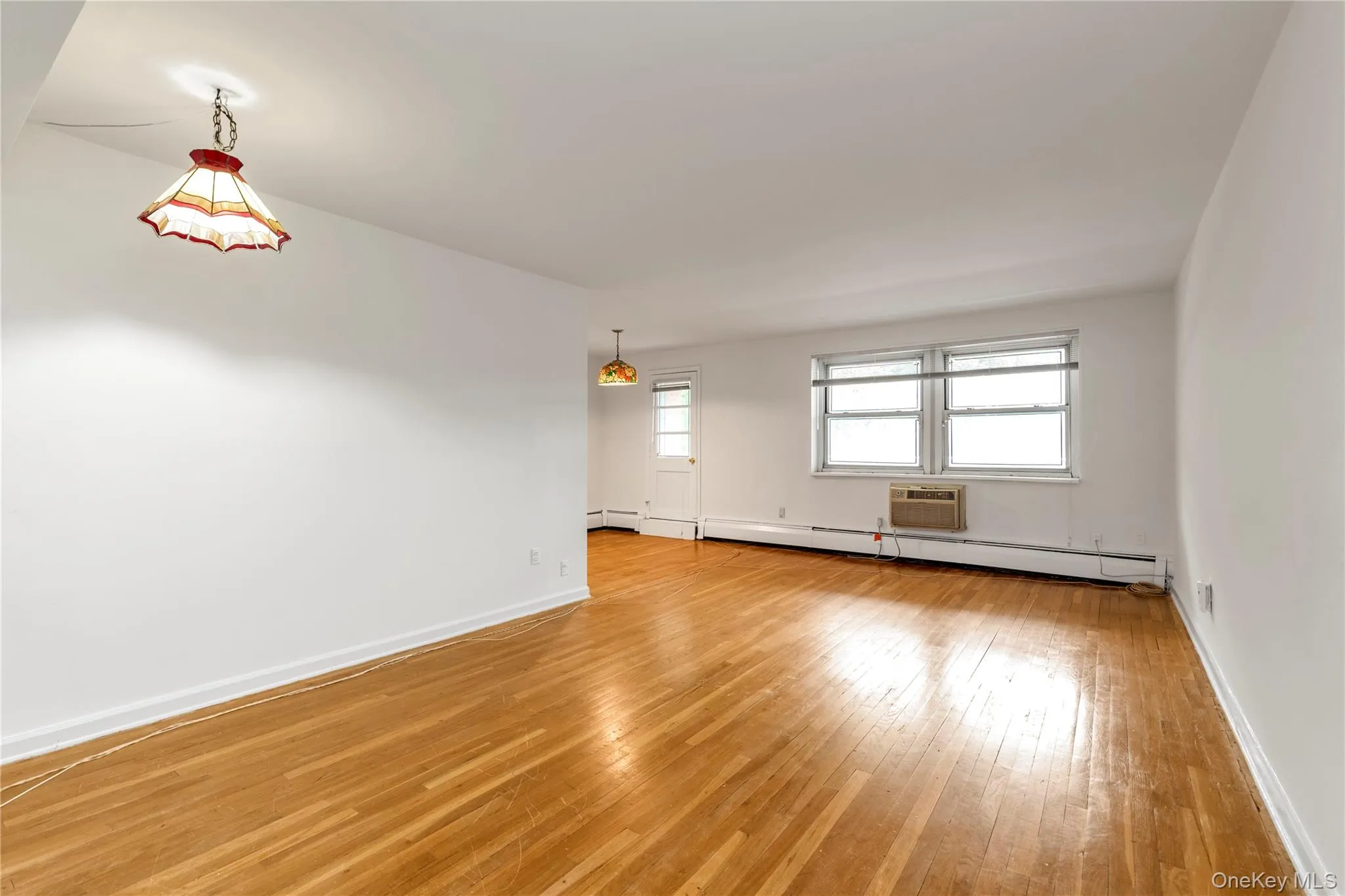 Living Room / Dining Area with Hardwood Floors Living Room / Dining Area with Hardwood Floors