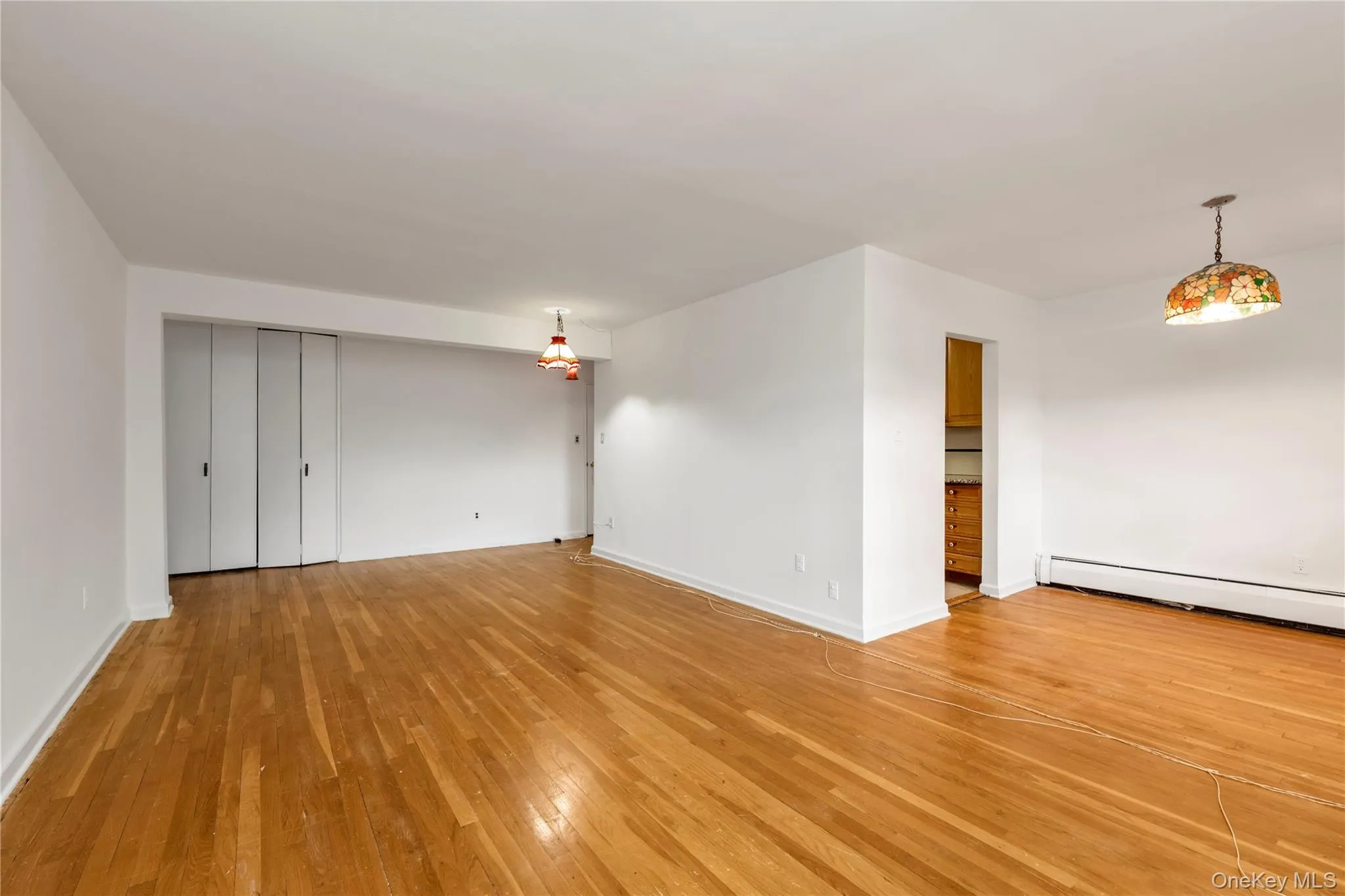 Living Room / Dining Area with Hardwood Floors Living Room / Dining Area with Hardwood Floors