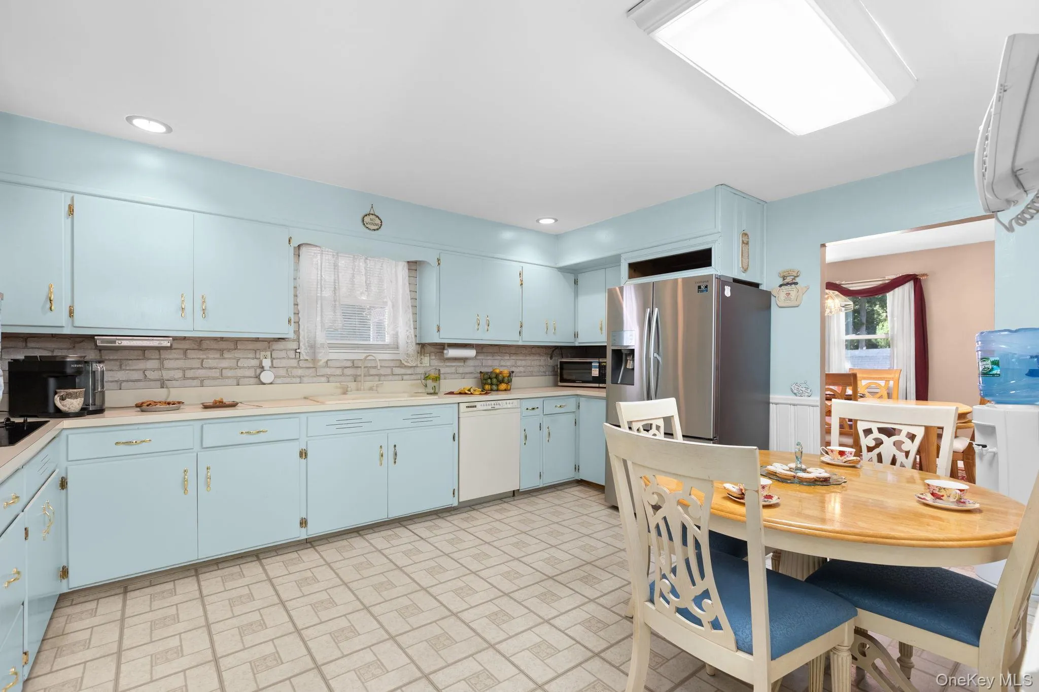 Kitchen with an abundance of cabinets for easy storage, stainless steel appliances and breakfast nook. Kitchen with an abundance of cabinets for easy storage, stainless steel appliances and breakfast nook.
