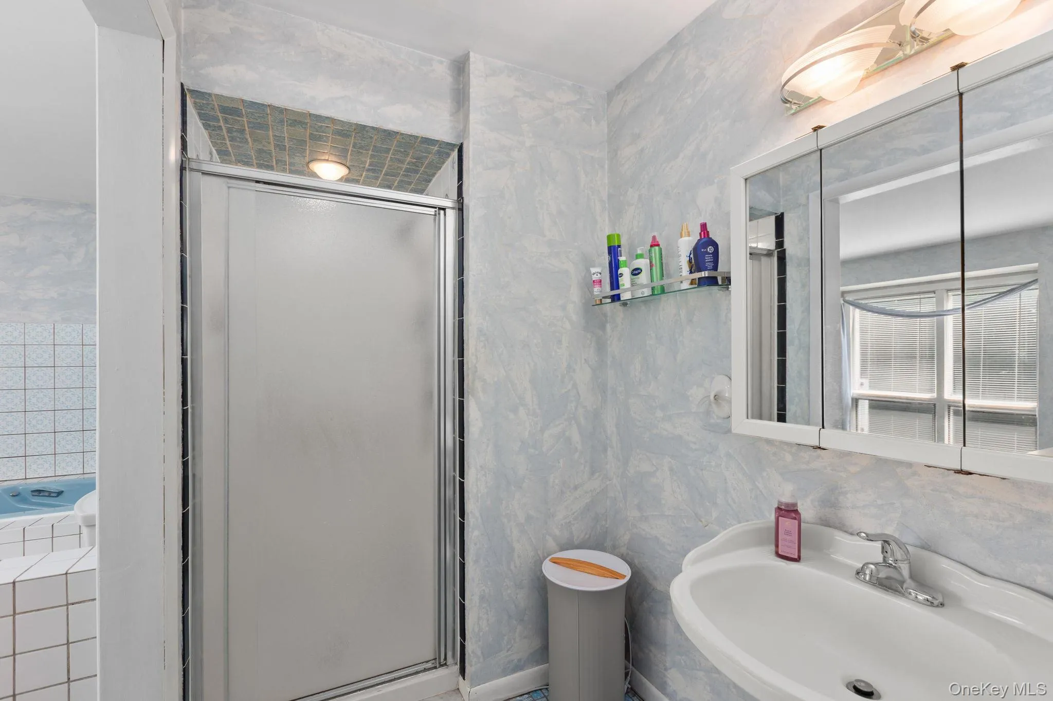 En-Suite bathroom with standup shower, sink and tri-view medicine cabinet. En-Suite bathroom with standup shower, sink and tri-view medicine cabinet.