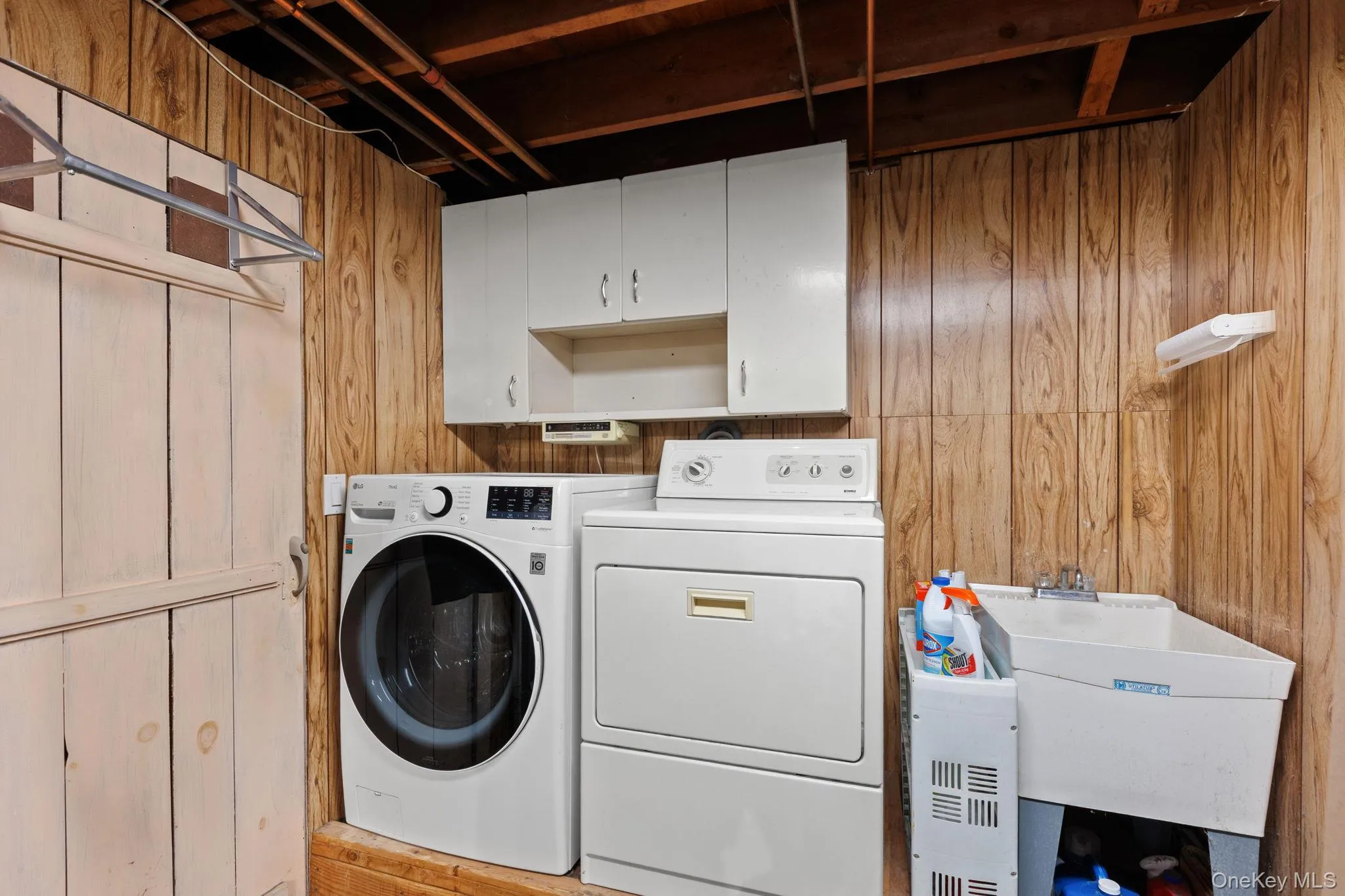 Laundry area located in garage. Laundry area located in garage.