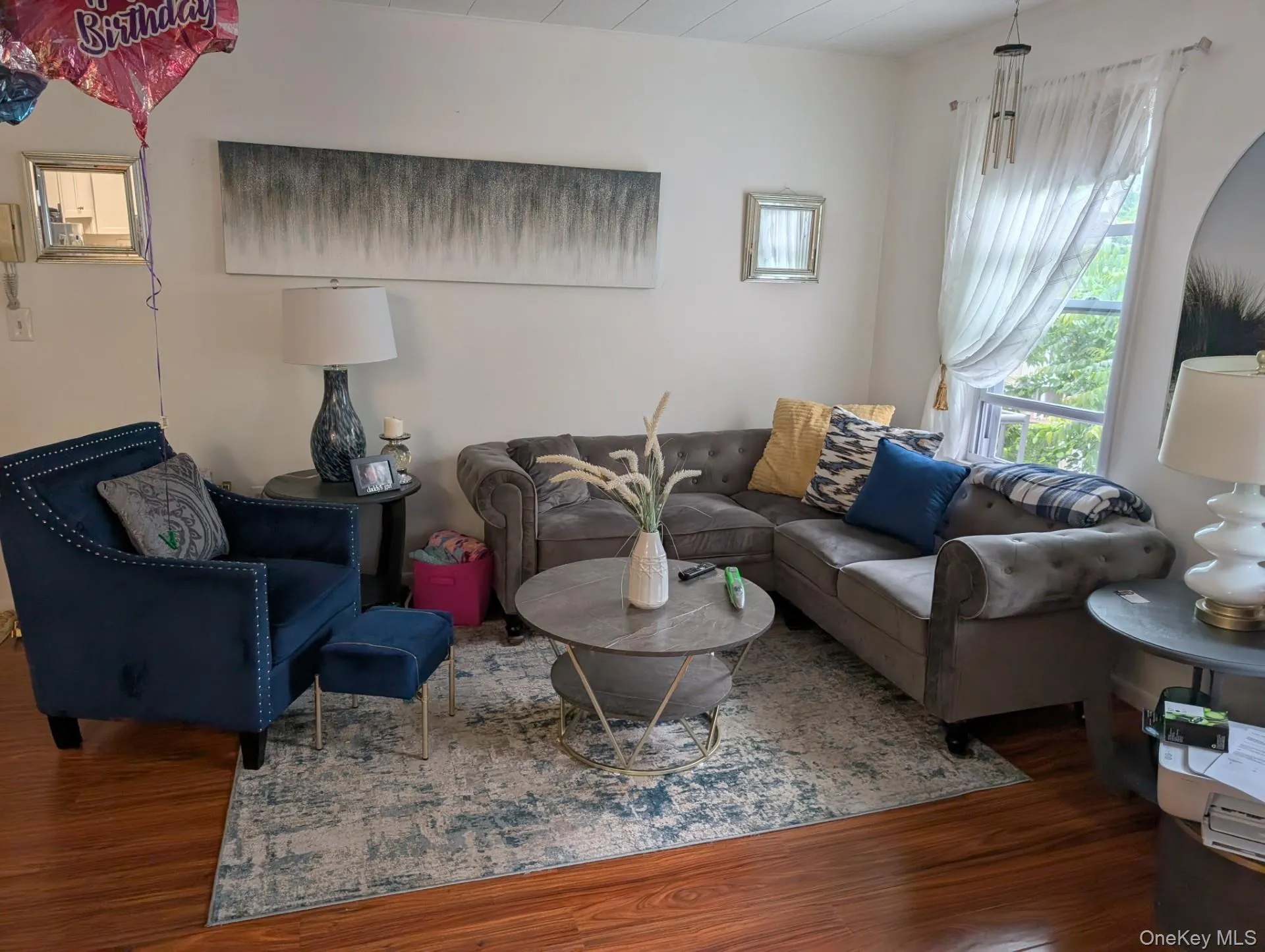 Living area featuring wood finished floors Living area featuring wood finished floors
