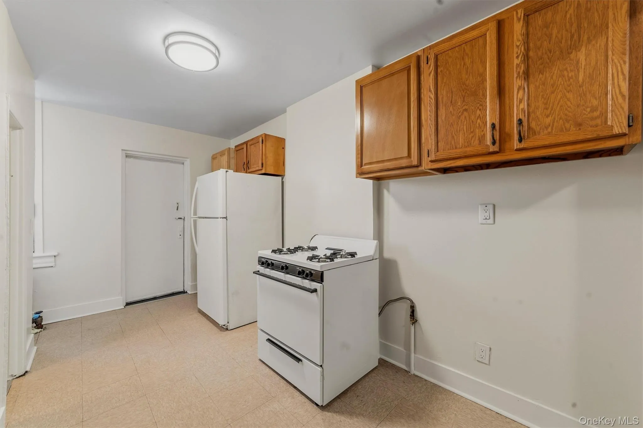 Eat-in-Kitchen with view door to back fire escape. Eat-in-Kitchen with view door to back fire escape.