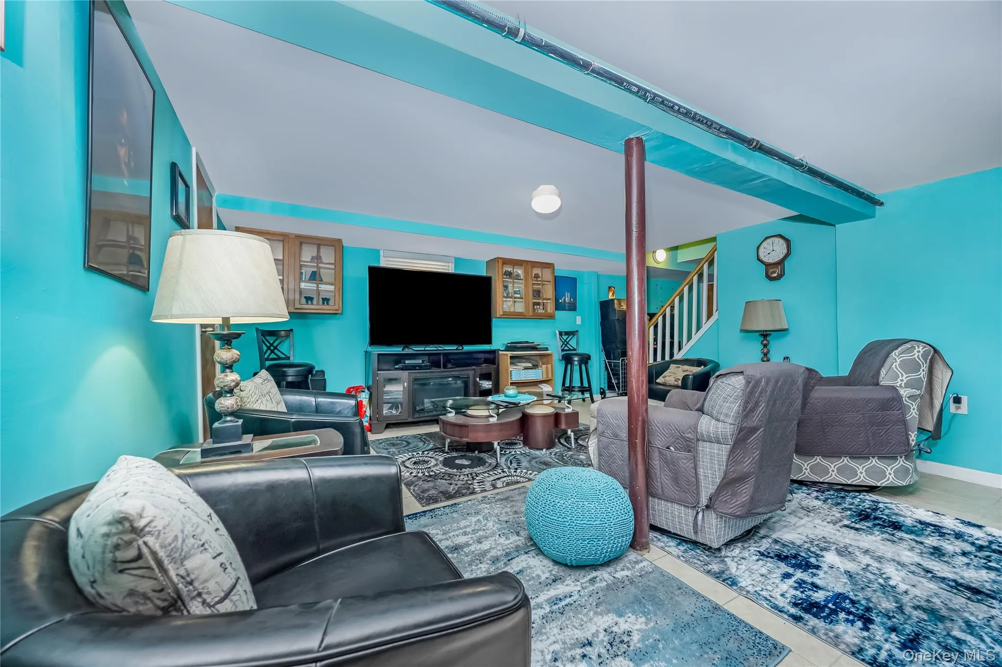 Lower level recreation room featuring vibrant wall color and recessed lighting Lower level recreation room featuring vibrant wall color and recessed lighting