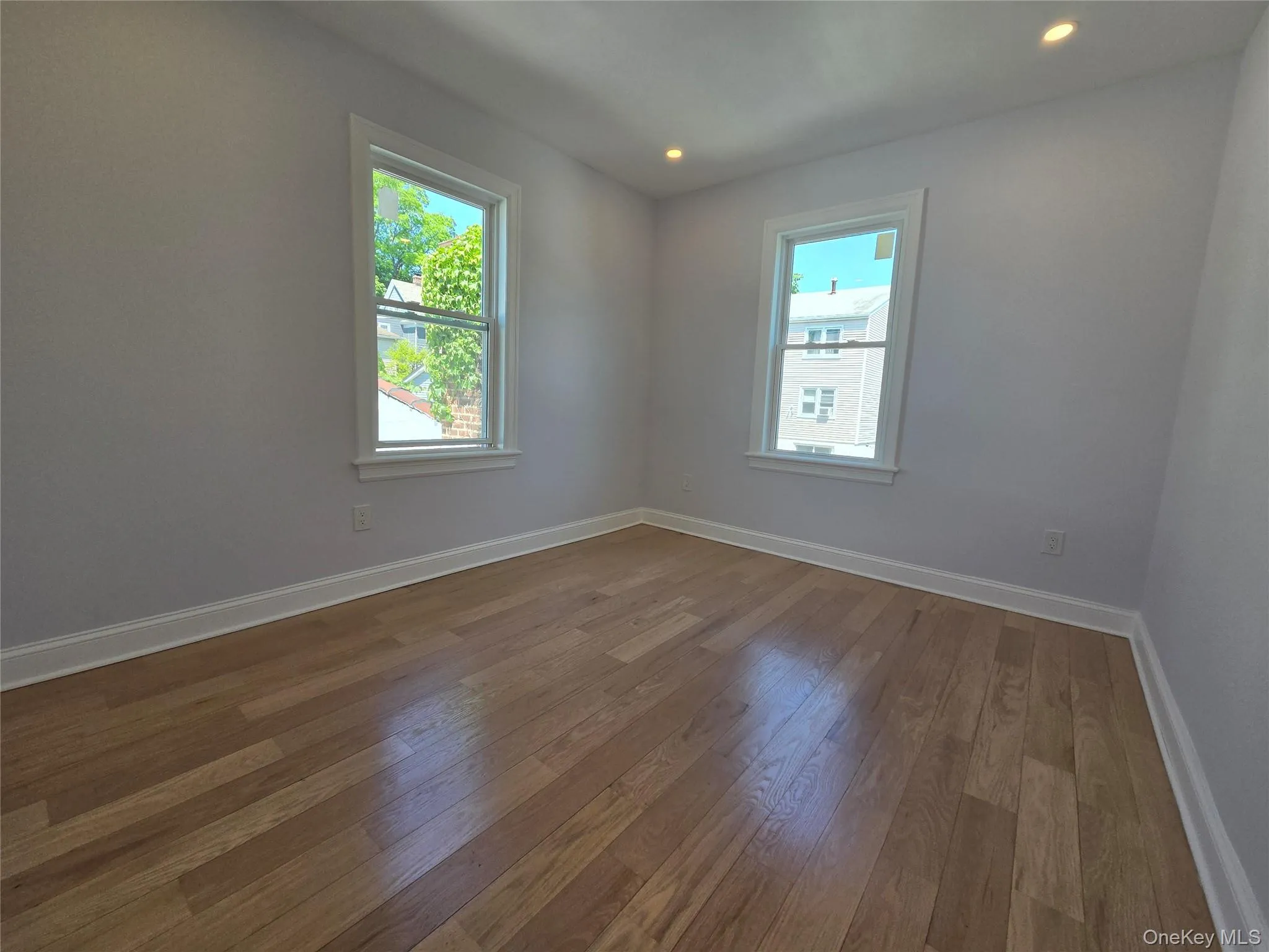Hardwood-style flooring throughout this bright room Hardwood-style flooring throughout this bright room