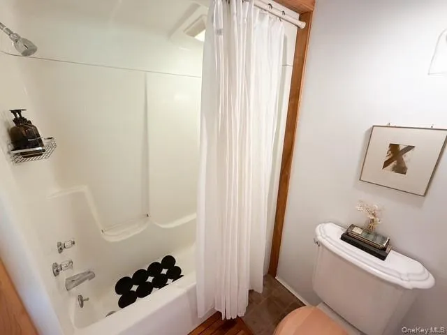 White fiberglass tub/shower combination with chrome fixtures White fiberglass tub/shower combination with chrome fixtures