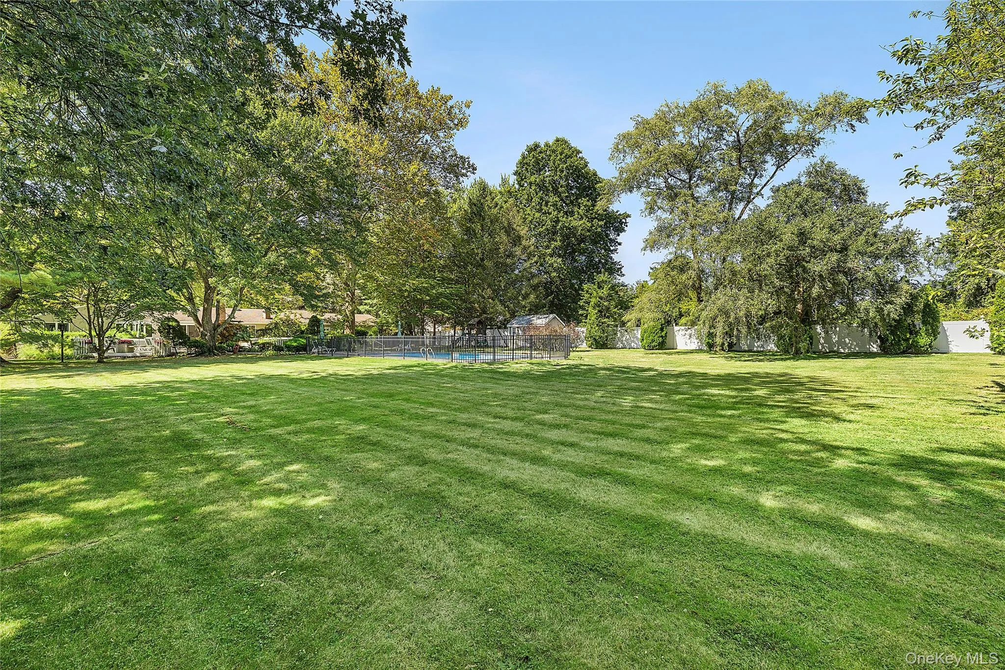 Flat property with mature trees Flat property with mature trees