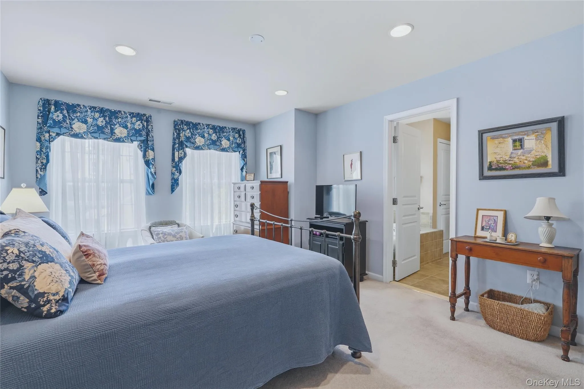 Primary bedroom with bathroom and walk in closet Primary bedroom with bathroom and walk in closet