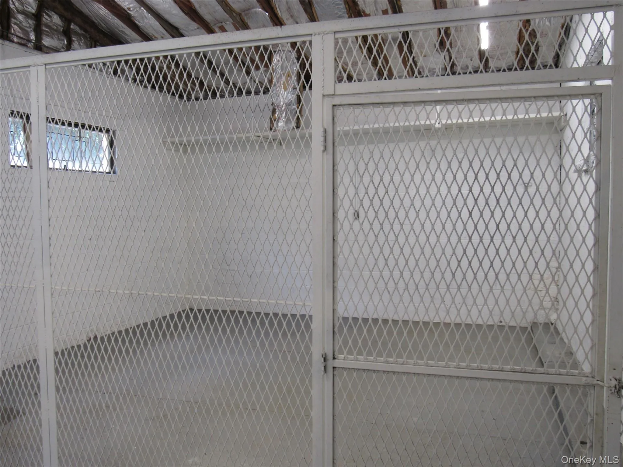 Rear storage area with security gate. Rear storage area with security gate.