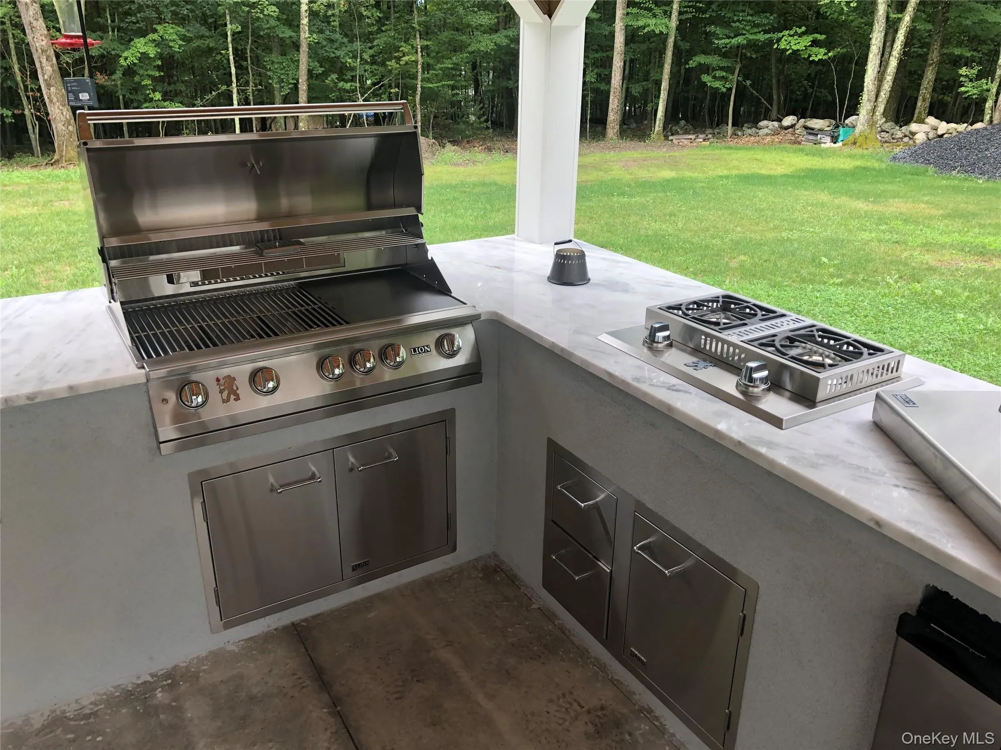 Gas grill and burners with ample granite cooking area in pavilion/gazebo Gas grill and burners with ample granite cooking area in pavilion/gazebo