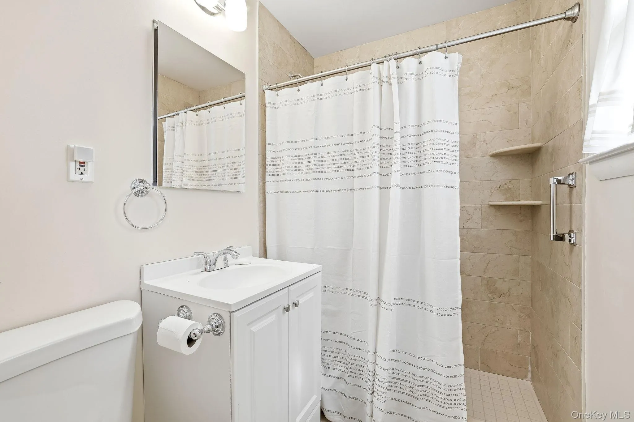 The renovated bathroom has a full-size shower stall and still another window that welcomes the morning sun The renovated bathroom has a full-size shower stall and still another window that welcomes the morning sun