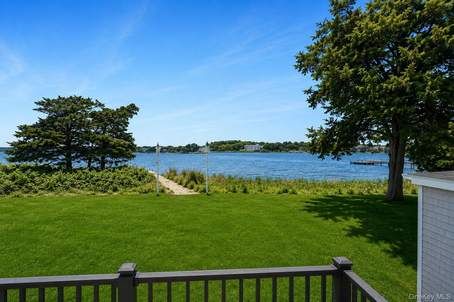Expansive waterfront view from balcony with direct water access Expansive waterfront view from balcony with direct water access