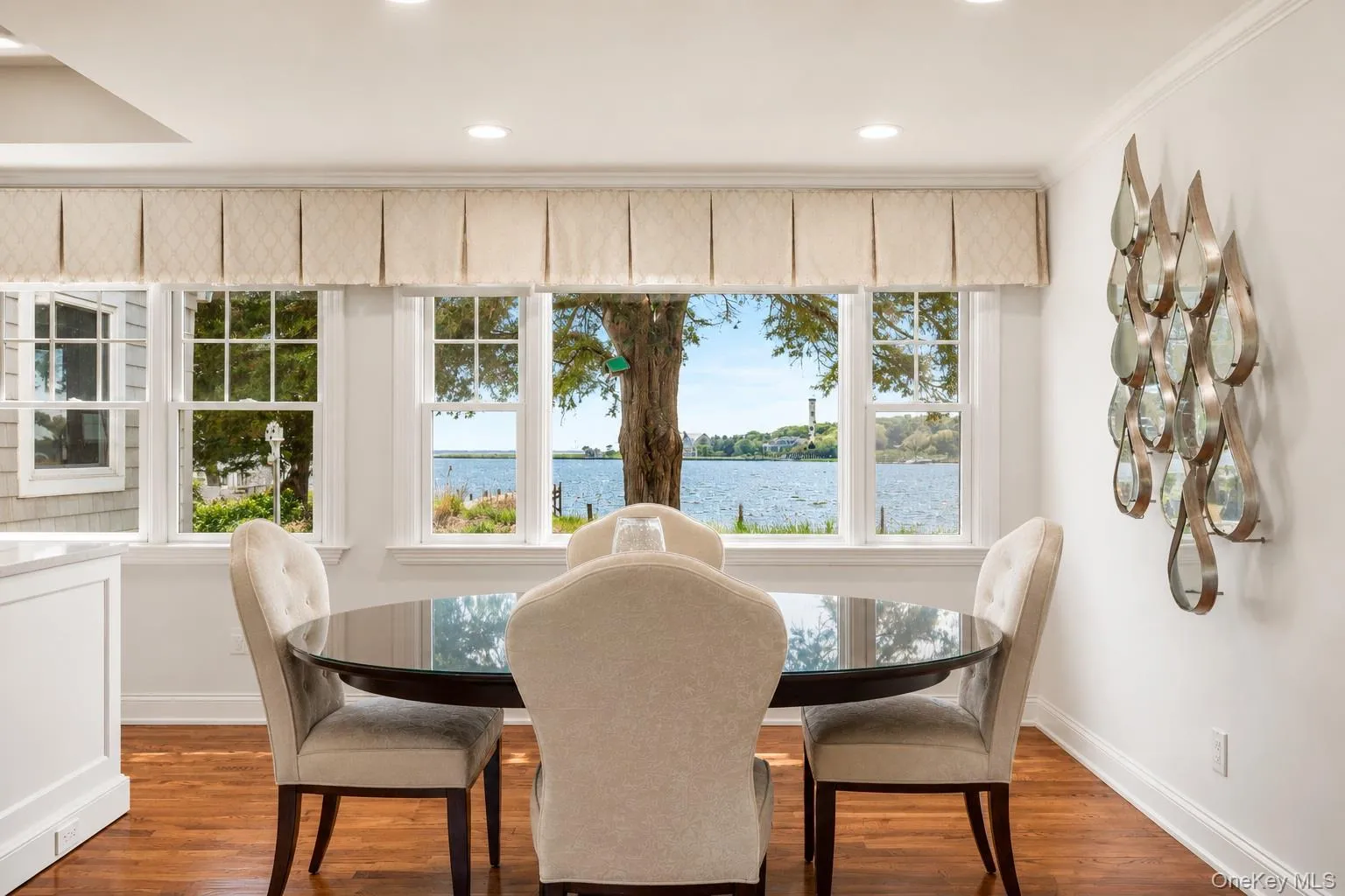 Dining area with hardwood flooring and recessed lighting Dining area with hardwood flooring and recessed lighting