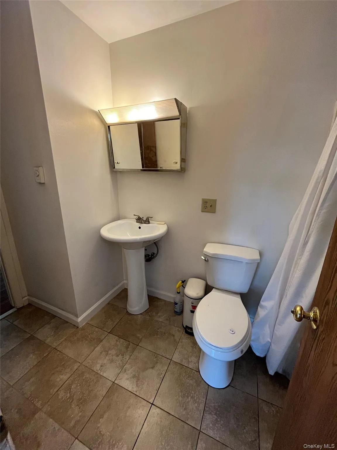 Bathroom with tile patterned flooring Bathroom with tile patterned flooring