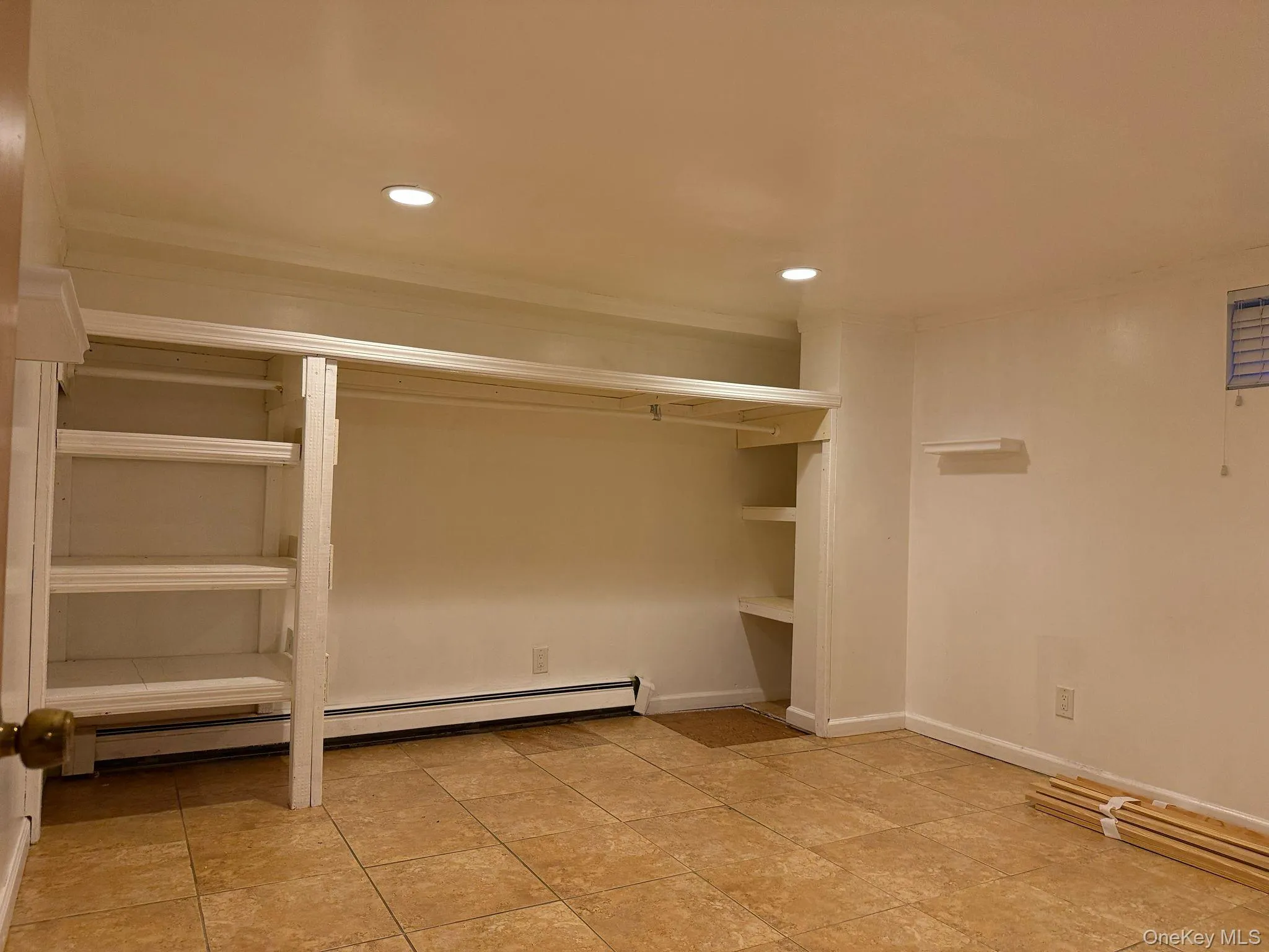 Walk in closet featuring baseboard heating Walk in closet featuring baseboard heating