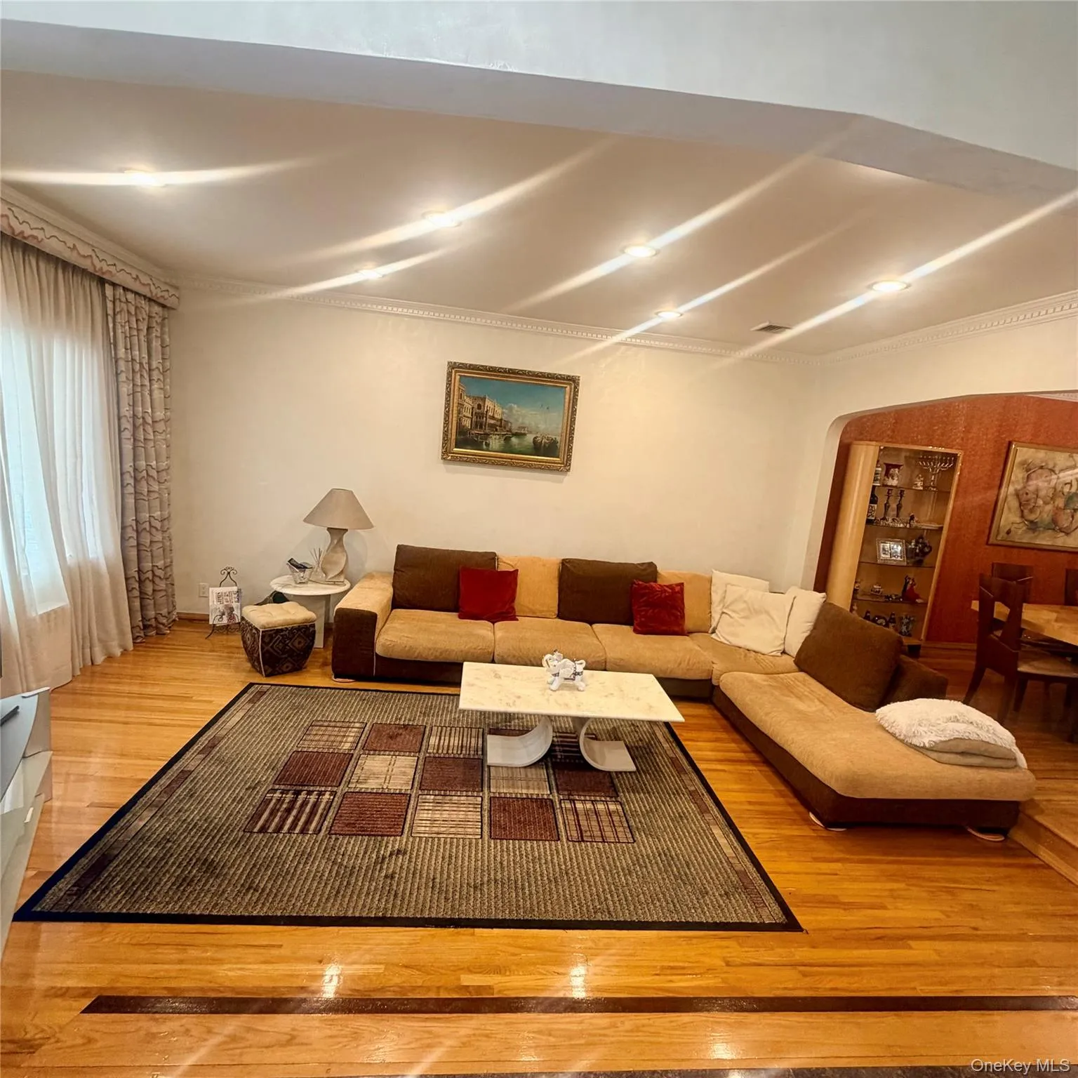 Hardwood flooring featuring a decorative border, recessed ceiling lighting. Hardwood flooring featuring a decorative border, recessed ceiling lighting.