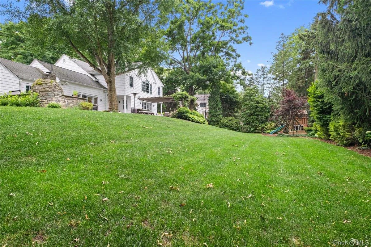 Expansive green lawn with gorgeous screening on all sides of the property Expansive green lawn with gorgeous screening on all sides of the property