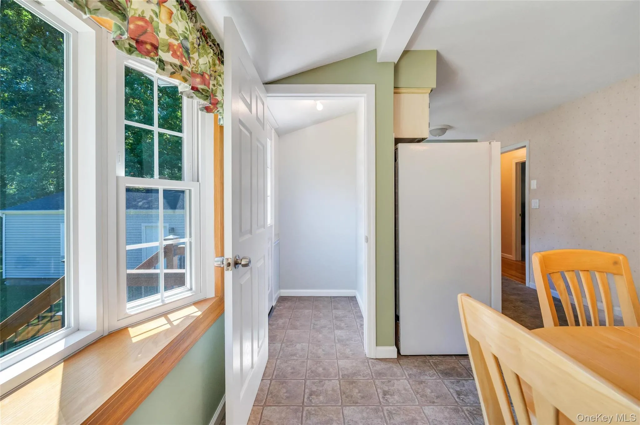 Back door to Backyard and pantry Back door to Backyard and pantry