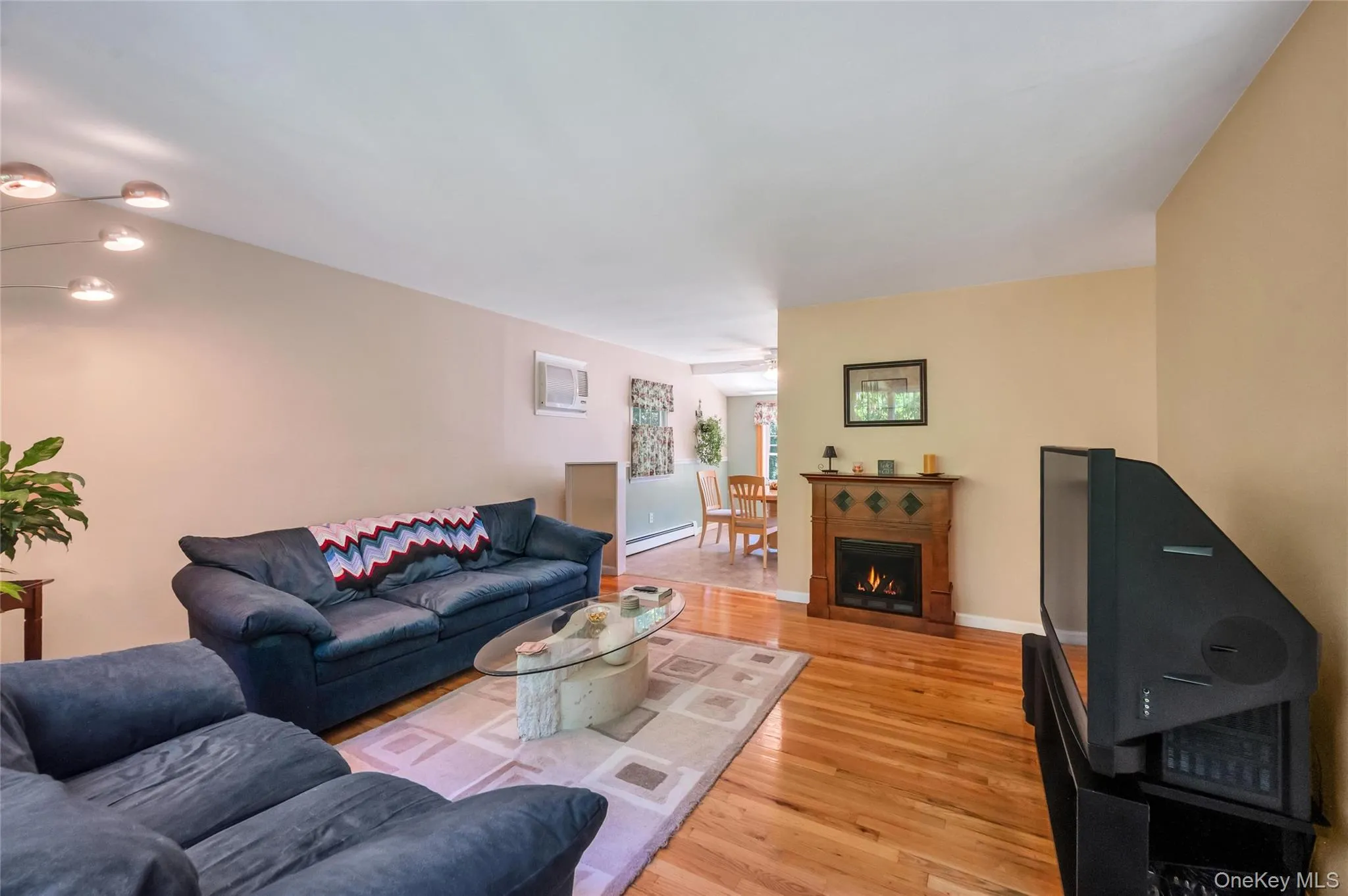 Hardwood flooring extends throughout this living space, Hardwood flooring extends throughout this living space,