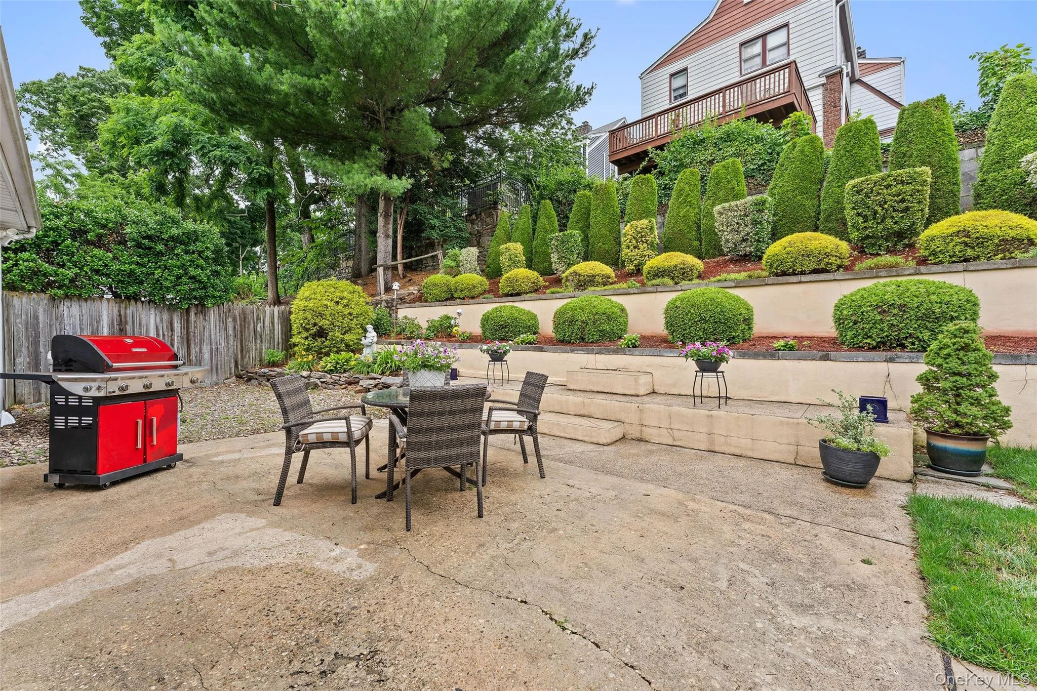 The great outdoors featuring an expansive patio and beautifully landscaped garden. The great outdoors featuring an expansive patio and beautifully landscaped garden.