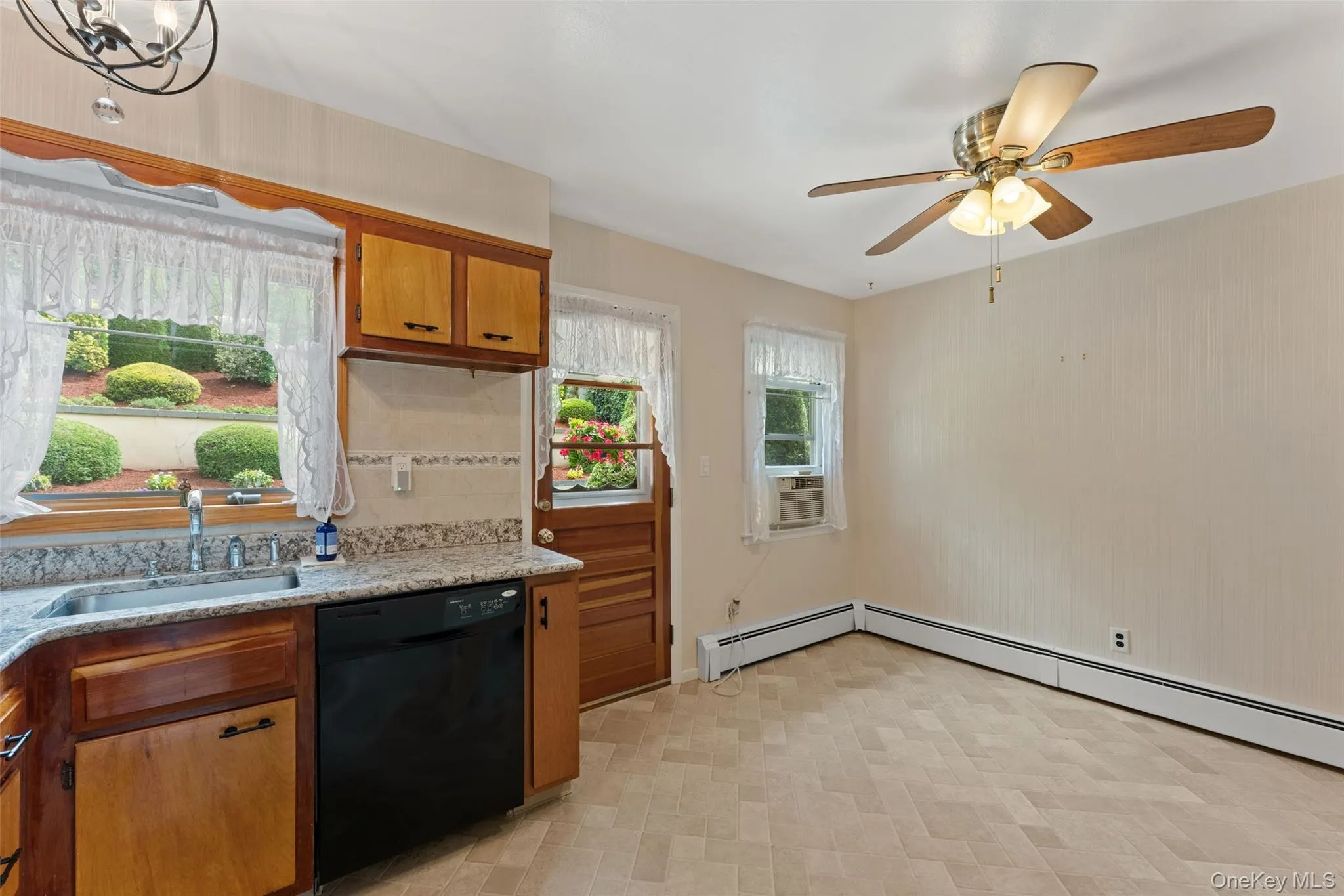 Dine-In Kitchen with view of access to the patio and garden. Dine-In Kitchen with view of access to the patio and garden.
