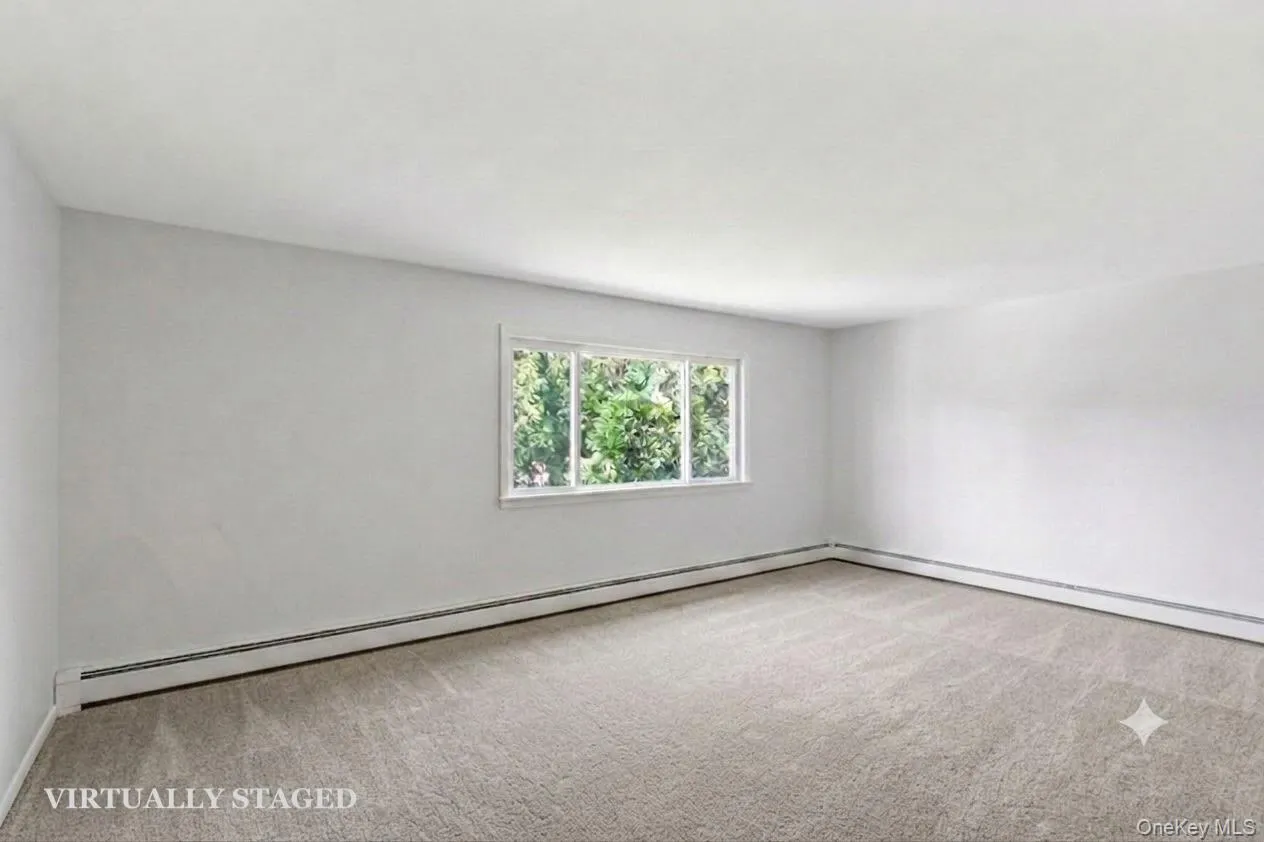 Living Room - virtually staged to show empty with new carpeting Living Room - virtually staged to show empty with new carpeting