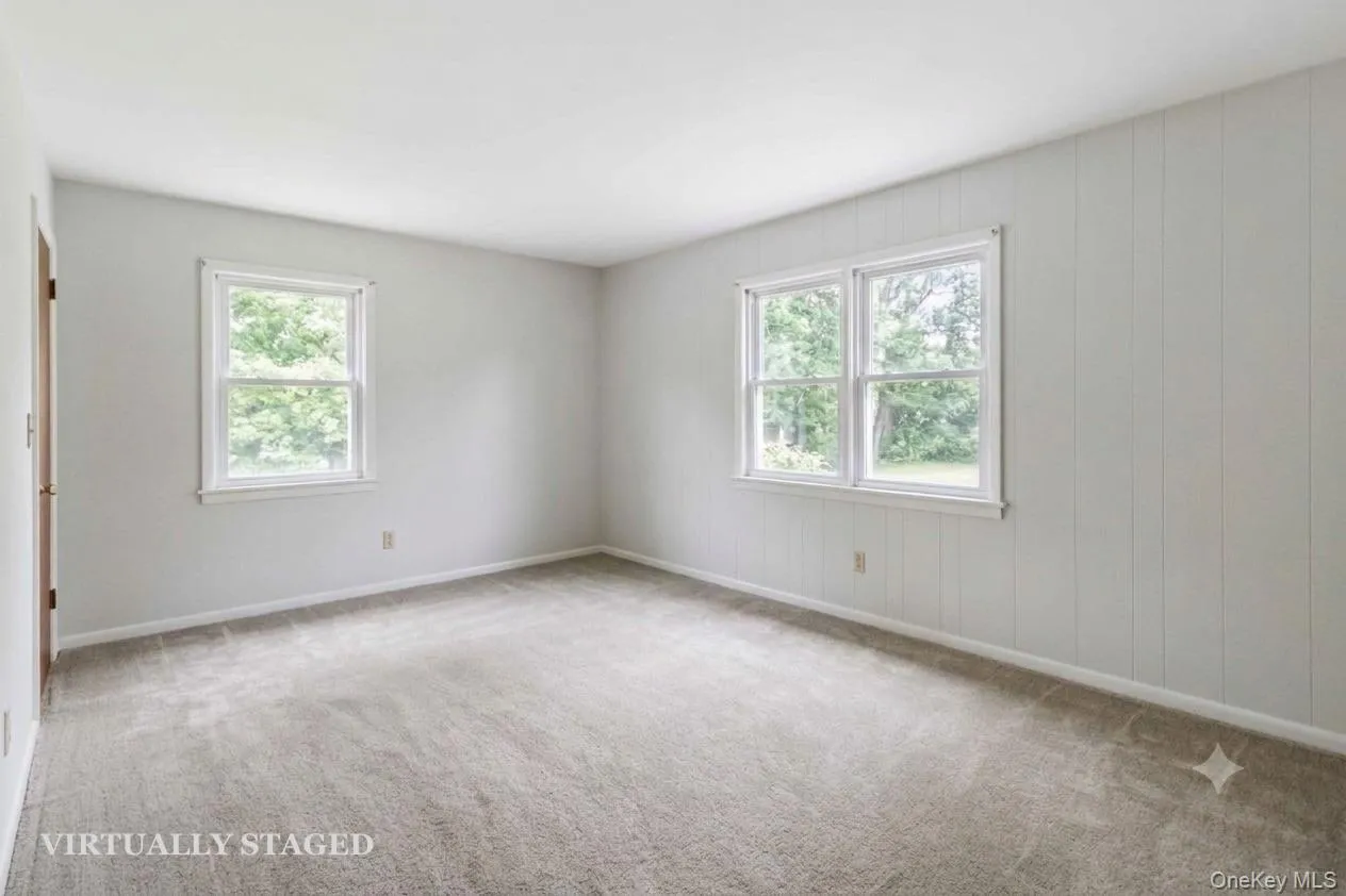 Bedroom 1 - virtually staged to show empty with new carpeting Bedroom 1 - virtually staged to show empty with new carpeting