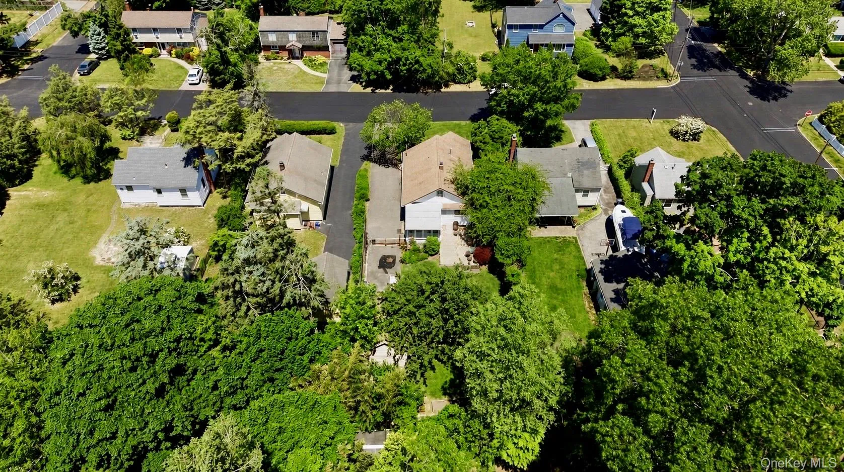 Residential neighborhood featuring mature trees and established properties Residential neighborhood featuring mature trees and established properties