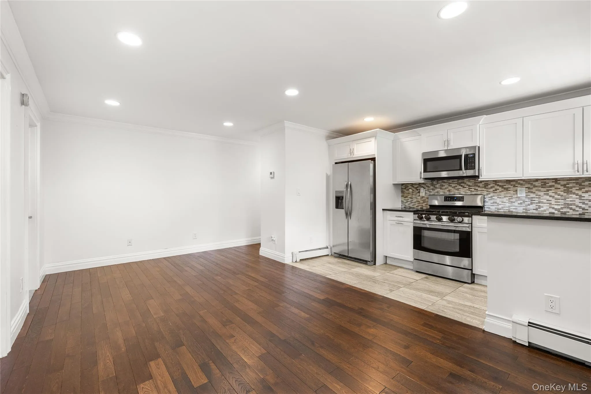 Kitchen area featuring room for a table and chairs, updated countertops and cabinetry, and recessed lighting Kitchen area featuring room for a table and chairs, updated countertops and cabinetry, and recessed lighting