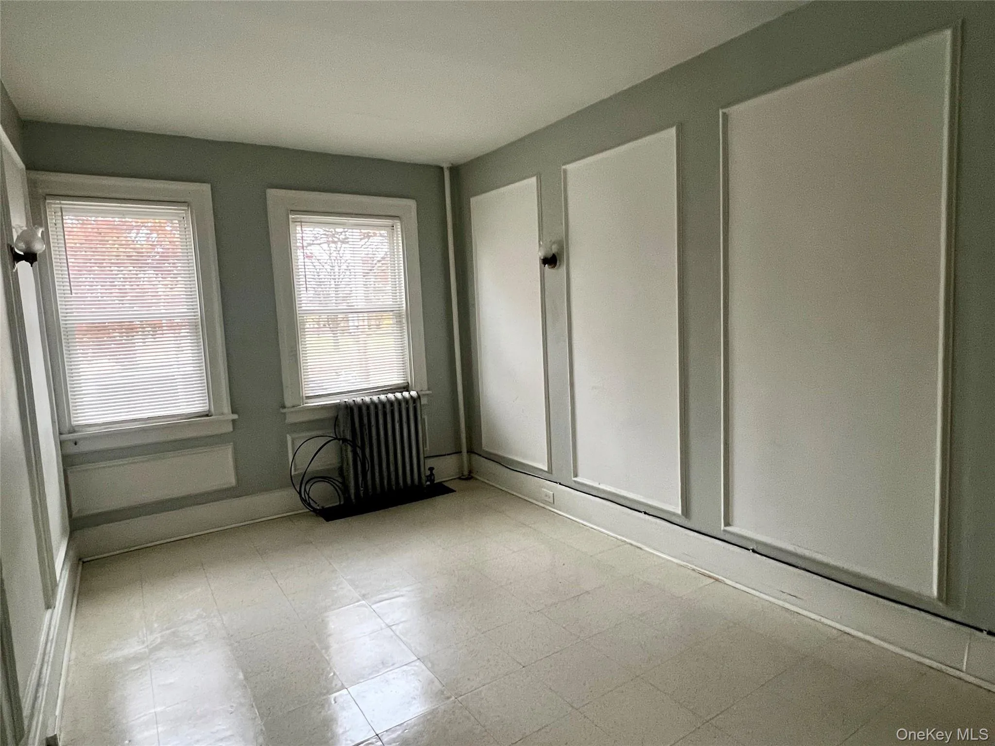 Unfurnished sunroom with radiator Unfurnished sunroom with radiator