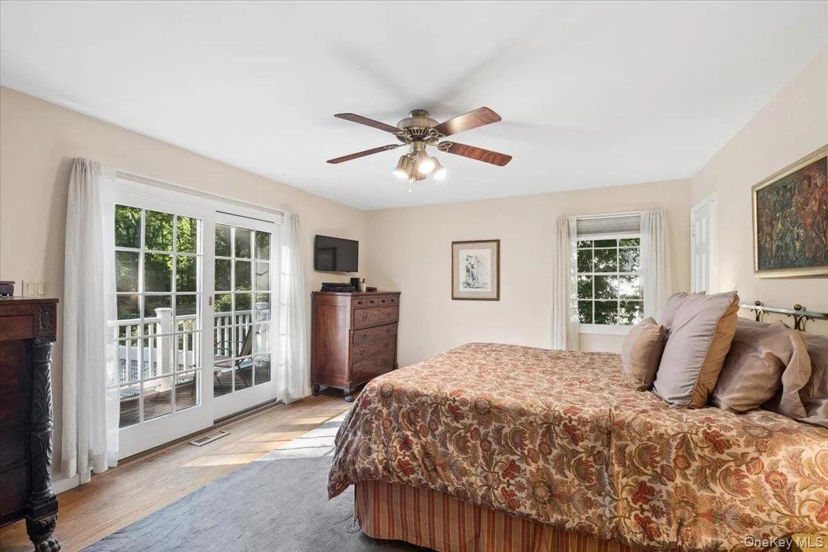 Primary bedroom retreat with doors to private deck Primary bedroom retreat with doors to private deck