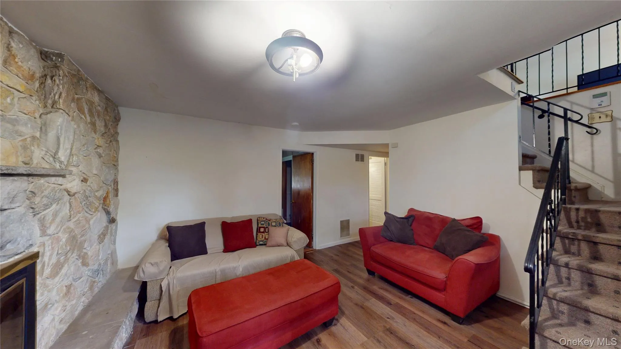 Lower level family room features a cultured stone woodburning fireplace. Lower level family room features a cultured stone woodburning fireplace.