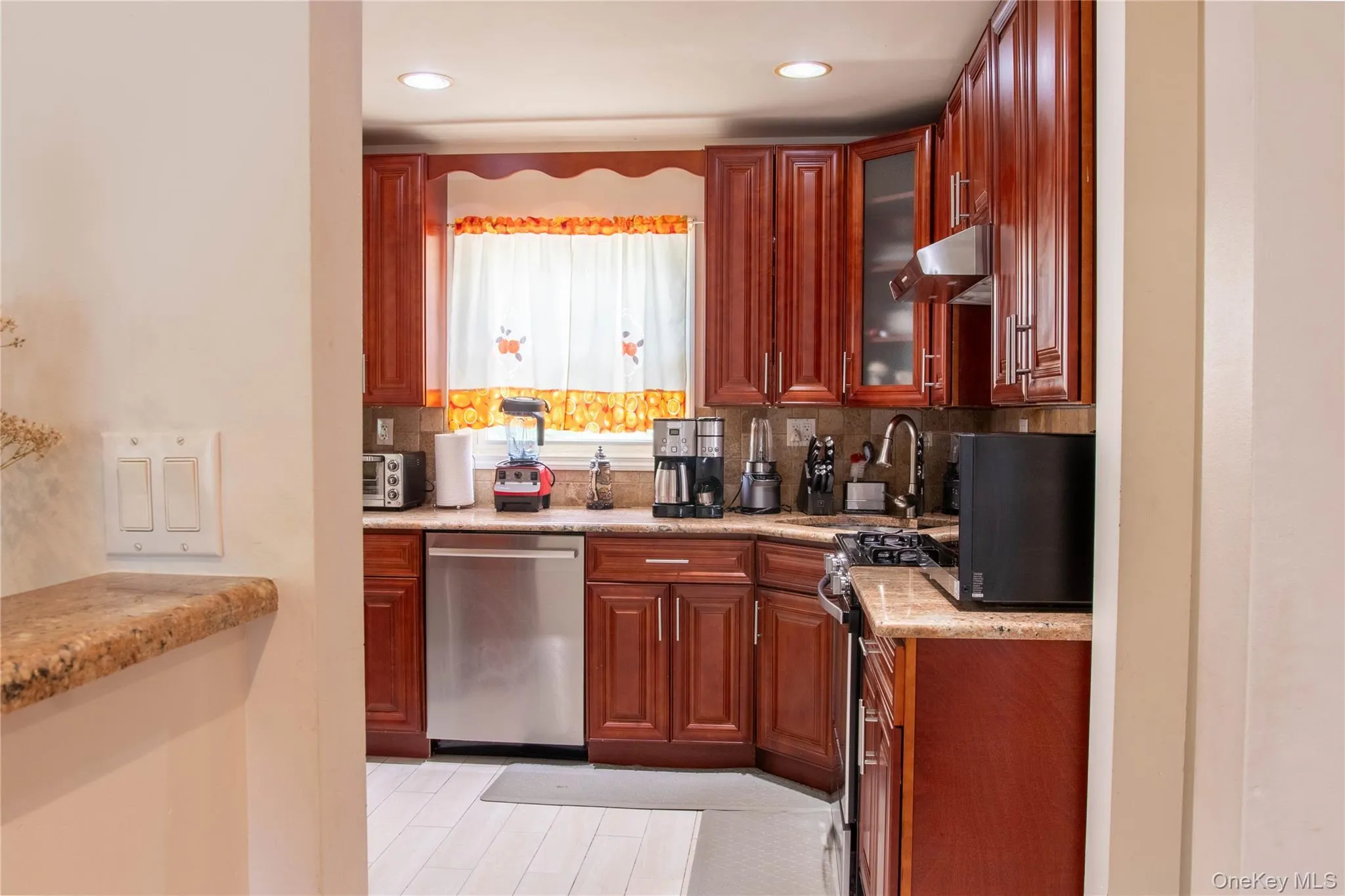 Kitchen with Stainless Steel Appliances, Updated Cabinets, Counters and Floor View from Hallway Kitchen with Stainless Steel Appliances, Updated Cabinets, Counters and Floor View from Hallway