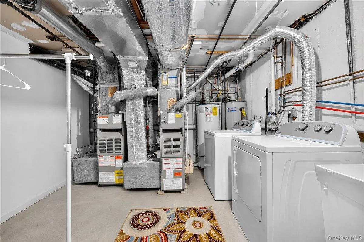 Basement Utility Room with 2 Separate A/C Handlers and water heaters Basement Utility Room with 2 Separate A/C Handlers and water heaters