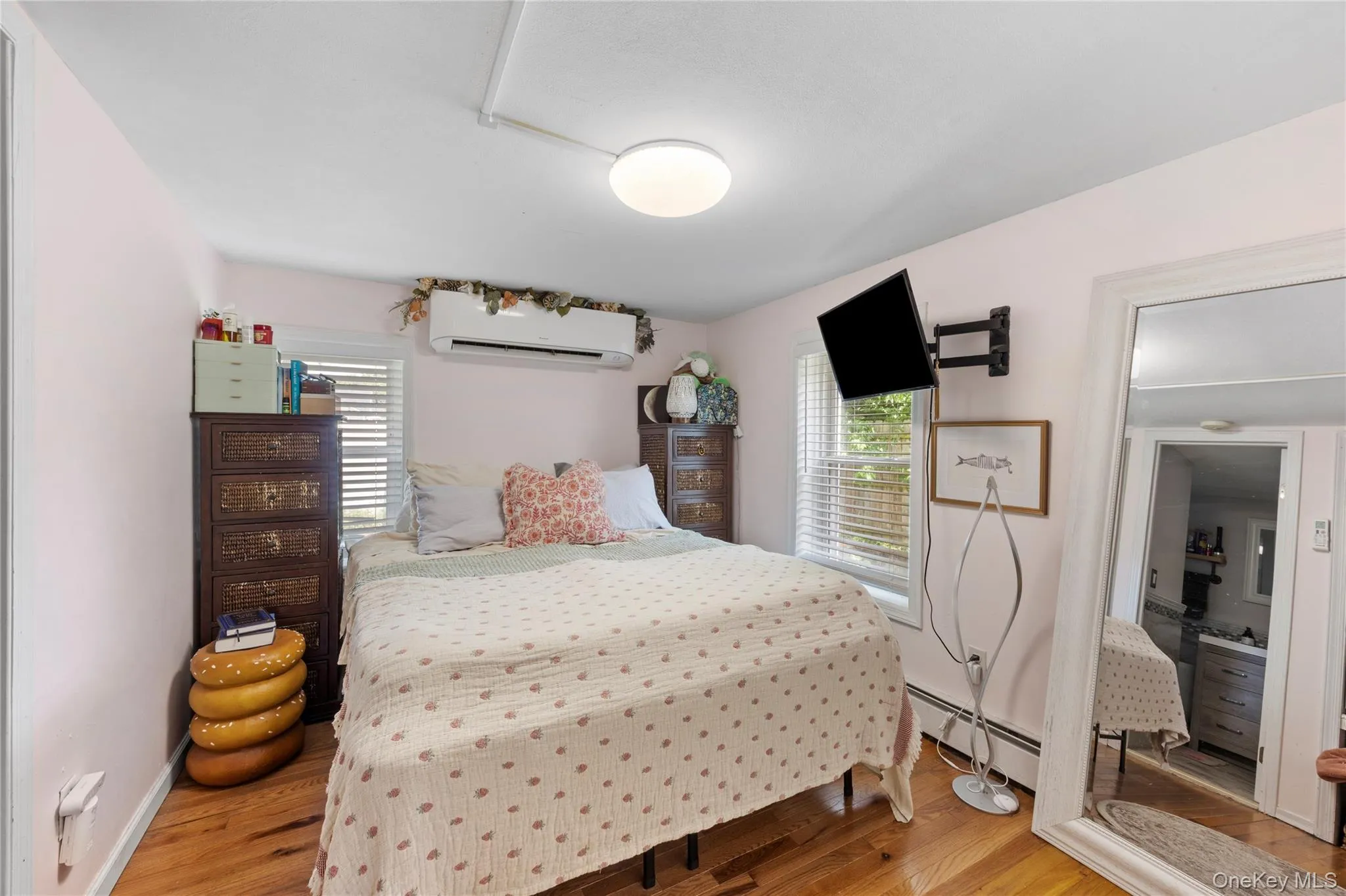 Hardwood flooring complements light-toned walls in this room Hardwood flooring complements light-toned walls in this room