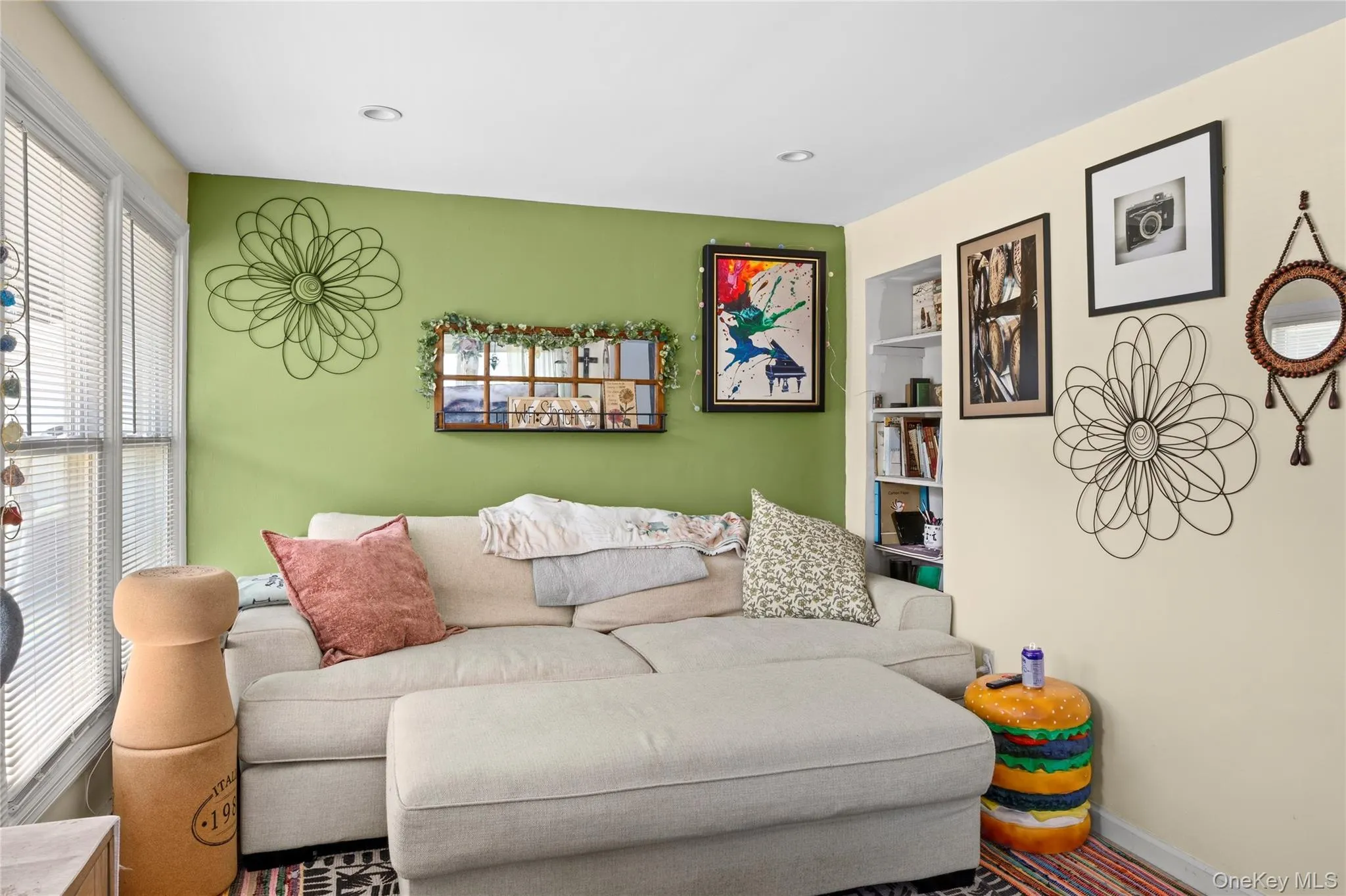 Recessed lighting illuminates a room featuring two-tone walls and built-in shelving Recessed lighting illuminates a room featuring two-tone walls and built-in shelving