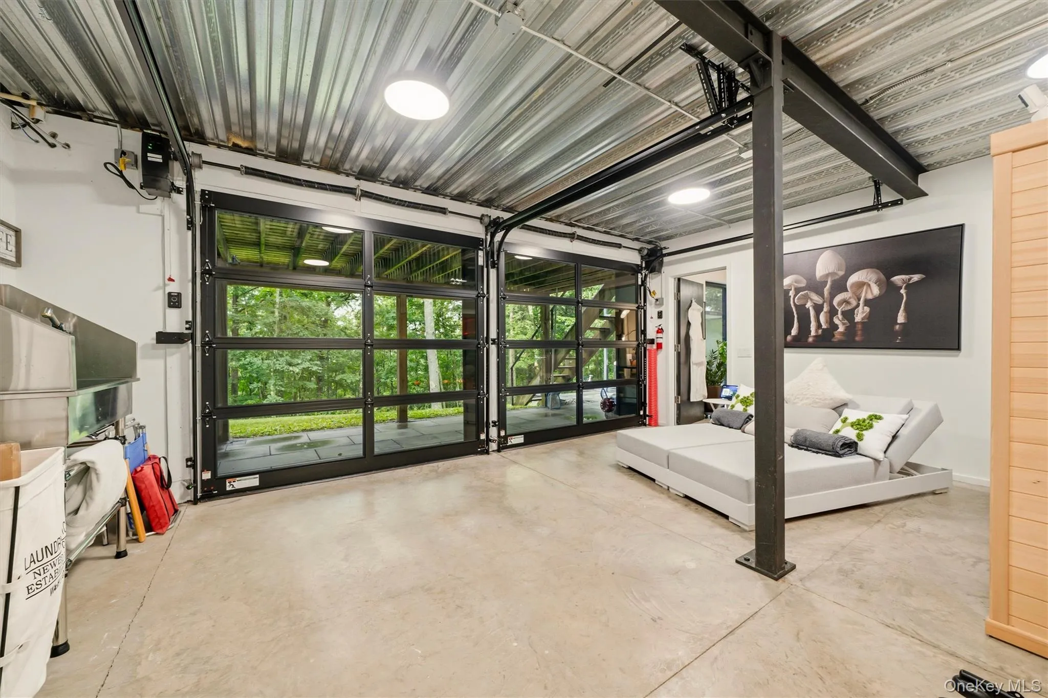 Glass garage doors open to outside Glass garage doors open to outside