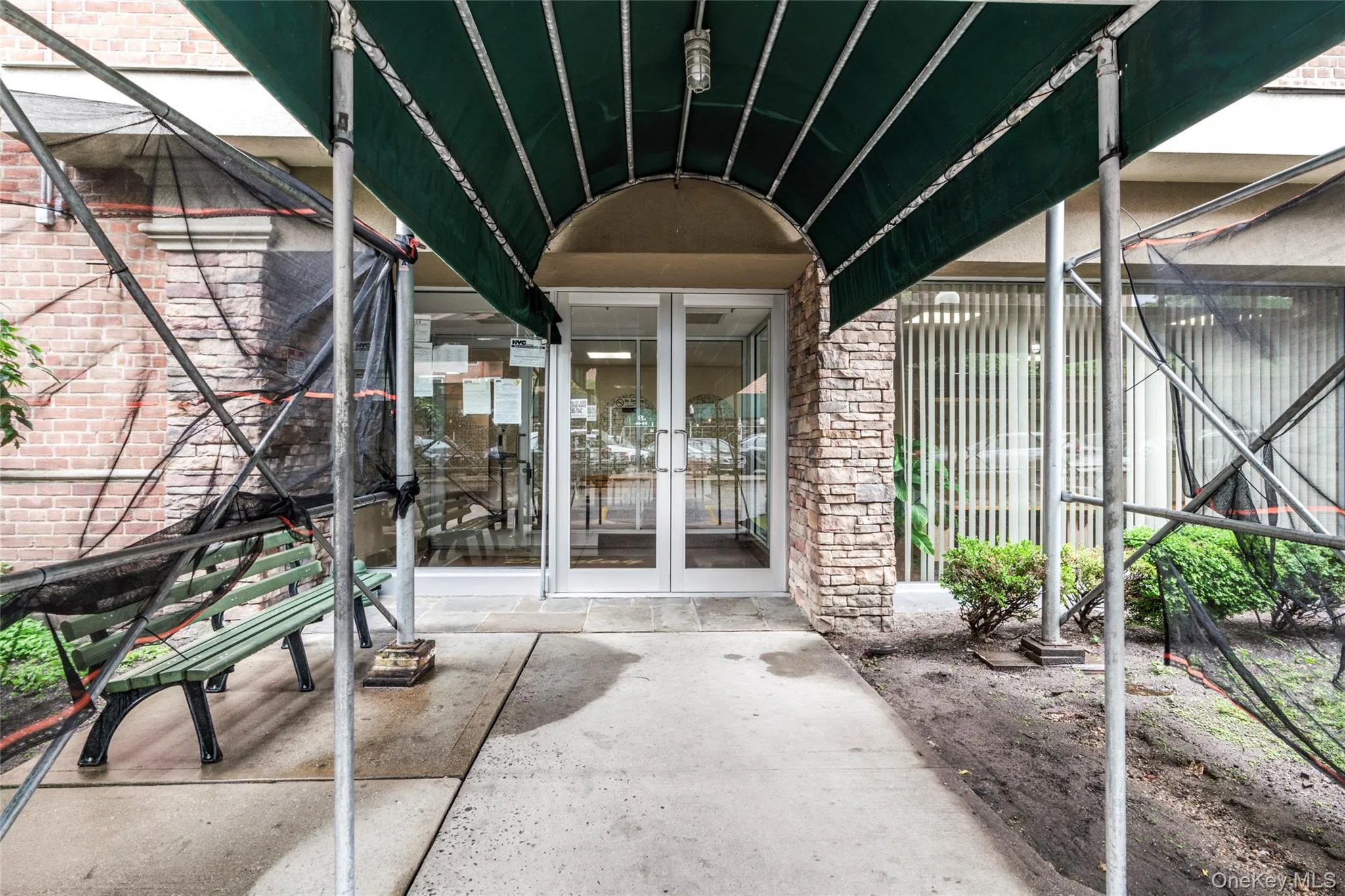 Entrance to property featuring french doors and brick siding Entrance to property featuring french doors and brick siding