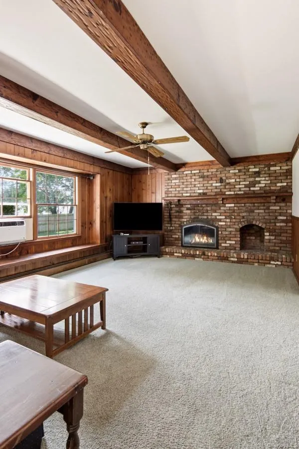 Cozy den with wood burning fireplace Cozy den with wood burning fireplace