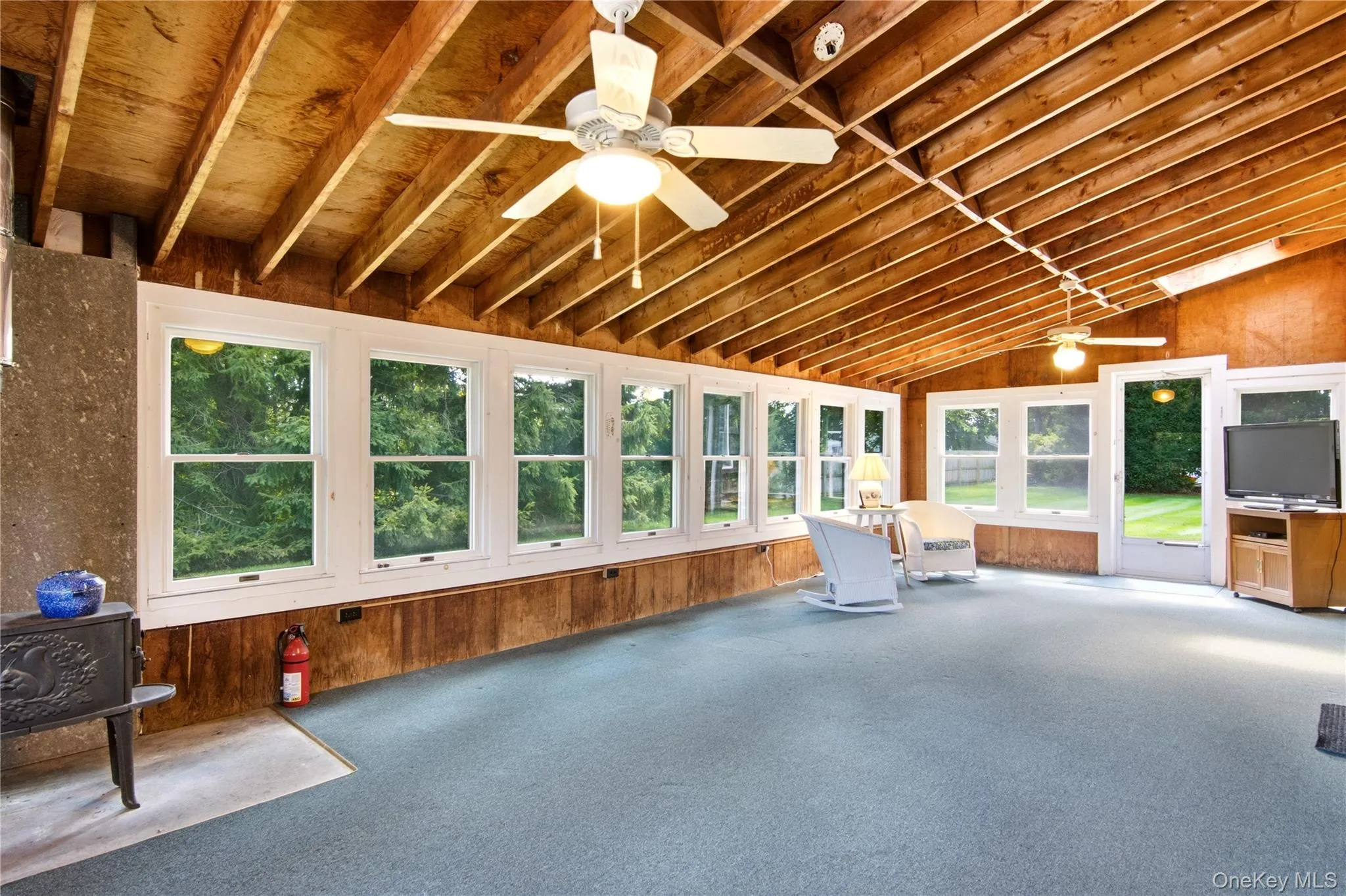 Sunroom with exposed beams ceiling Sunroom with exposed beams ceiling