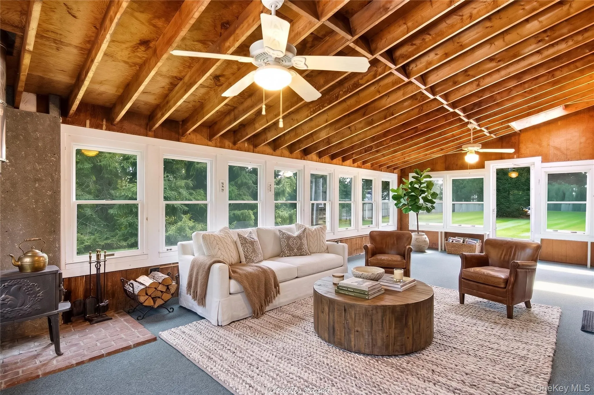 Virtually staged, expansive sunroom Virtually staged, expansive sunroom
